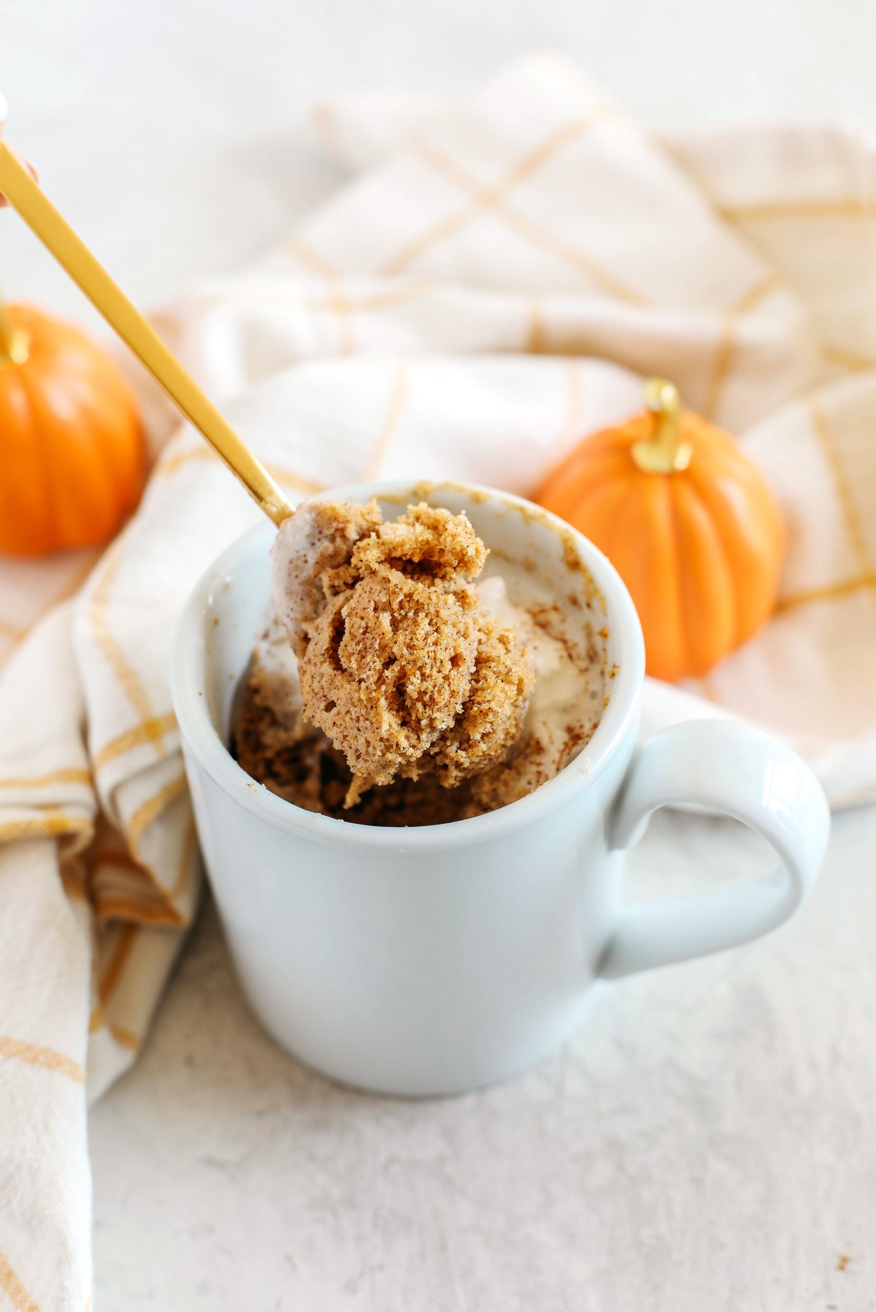 The most delicious Pumpkin Spice Mug Cake that makes the perfect single serving and easily made in under 2 minutes!  It's also gluten-free, dairy-free and paleo!  