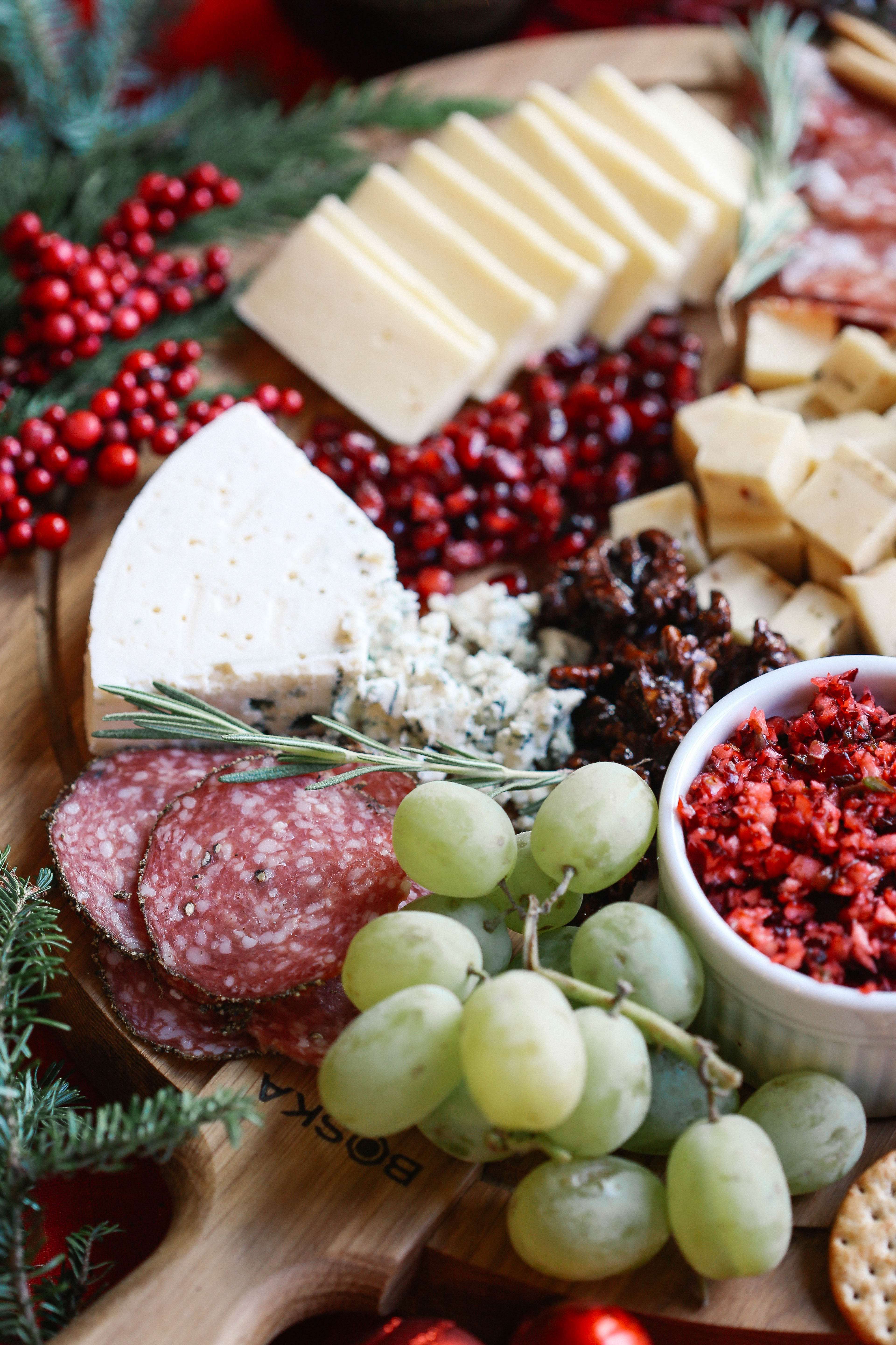 Learn how to create the perfect holiday cheese board in just five simple steps with an assortment of cheeses, meats, fruits, nuts, and a variety of spreads!