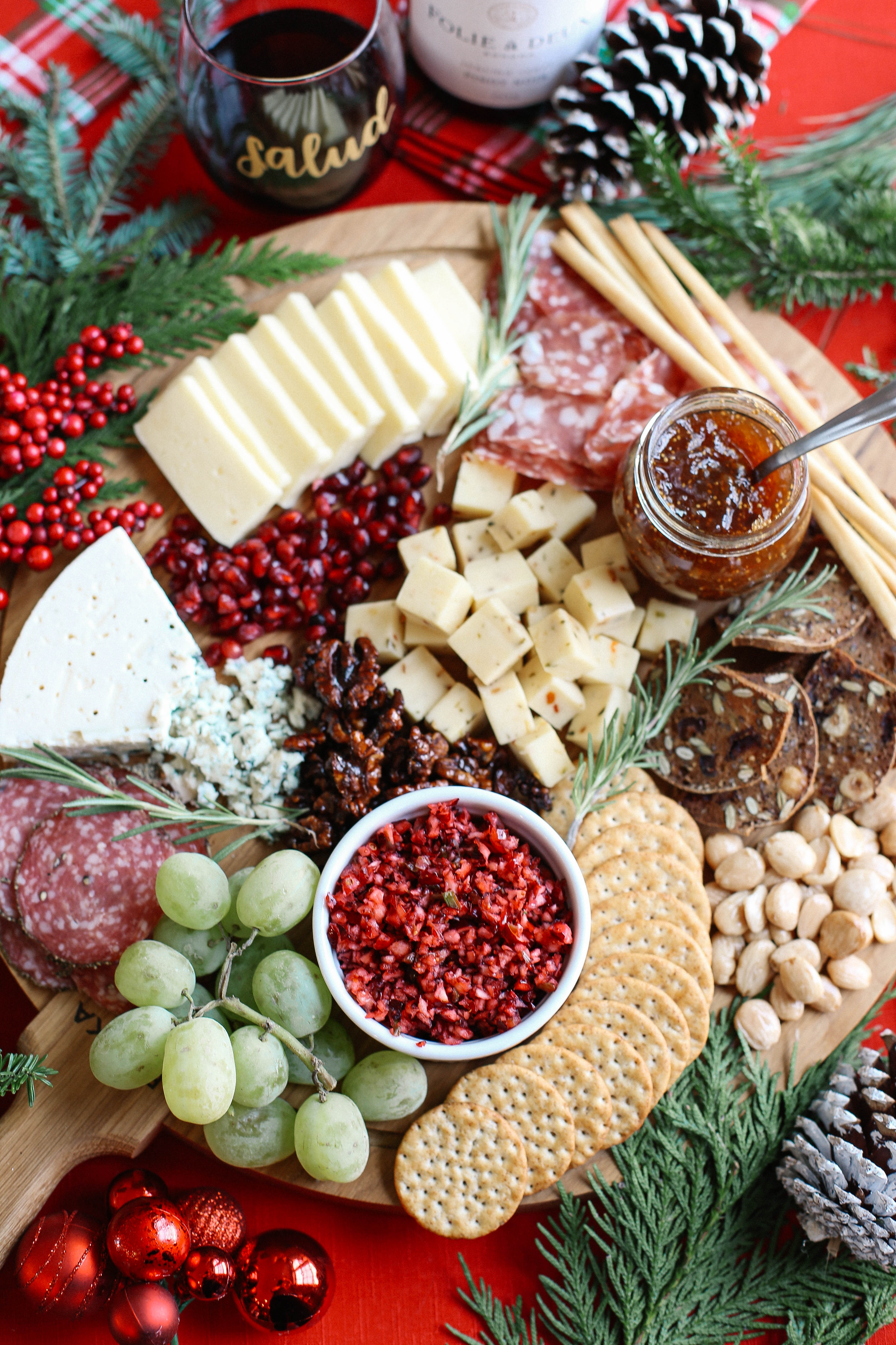 Learn how to create the perfect holiday cheese board in just five simple steps with an assortment of cheeses, meats, fruits, nuts, and a variety of spreads!