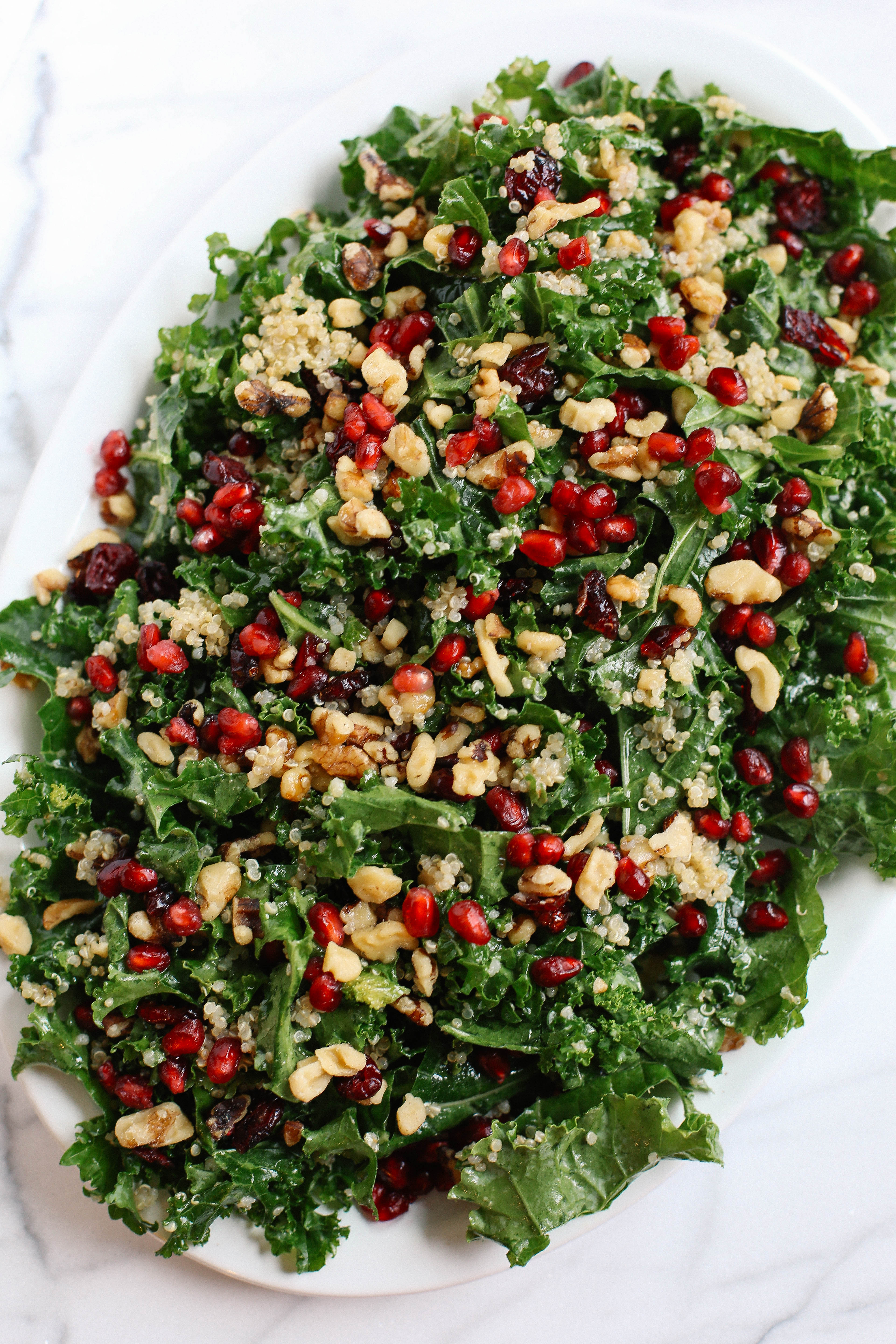 This Winter Kale and Quinoa Salad makes the perfect healthy holiday side dish that is sweet, crunchy and super easy to make!