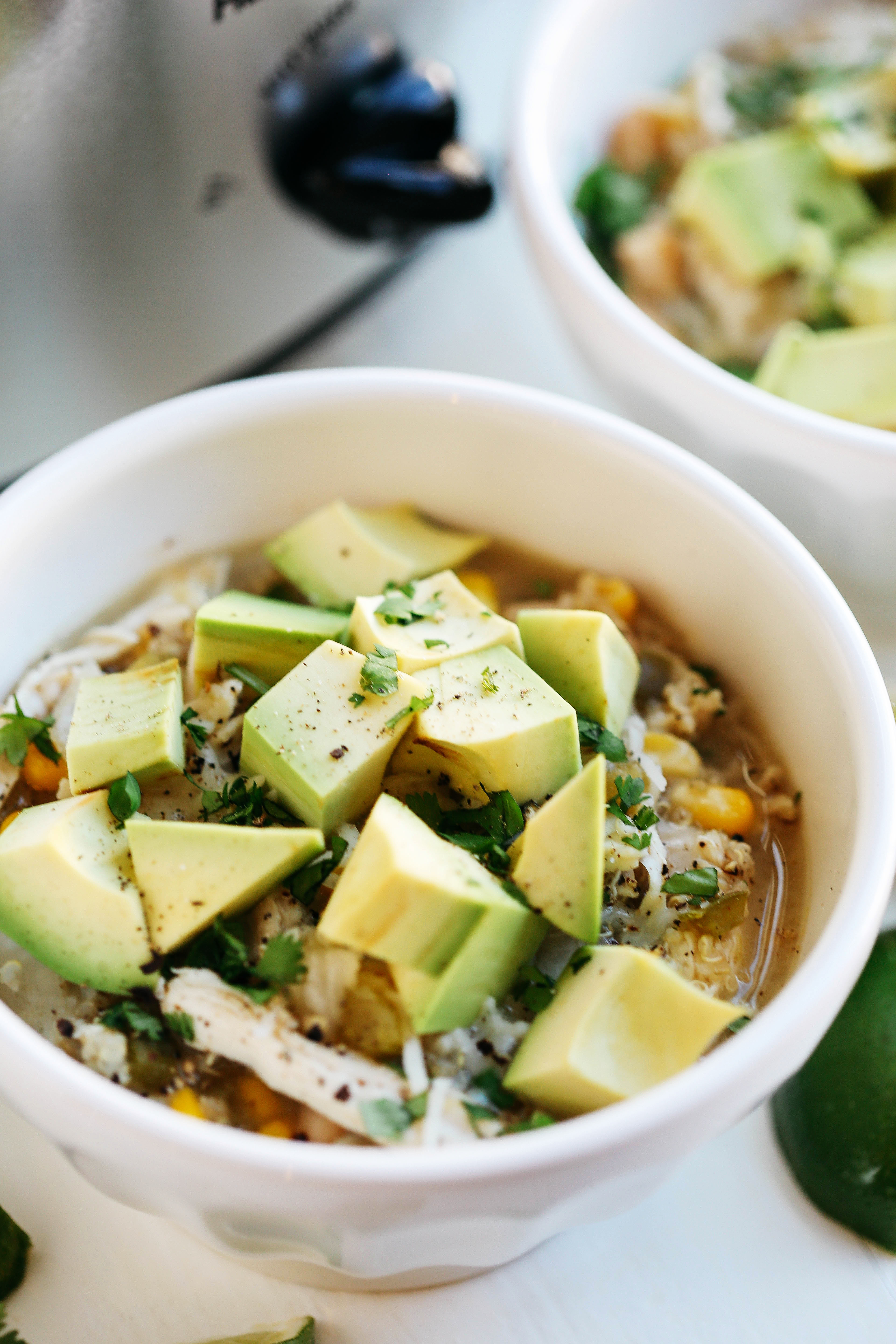 This Slow Cooker White Chicken and Quinoa Chili is the perfect blend of hearty and healthy that will keep you warm and cozy all winter long!
