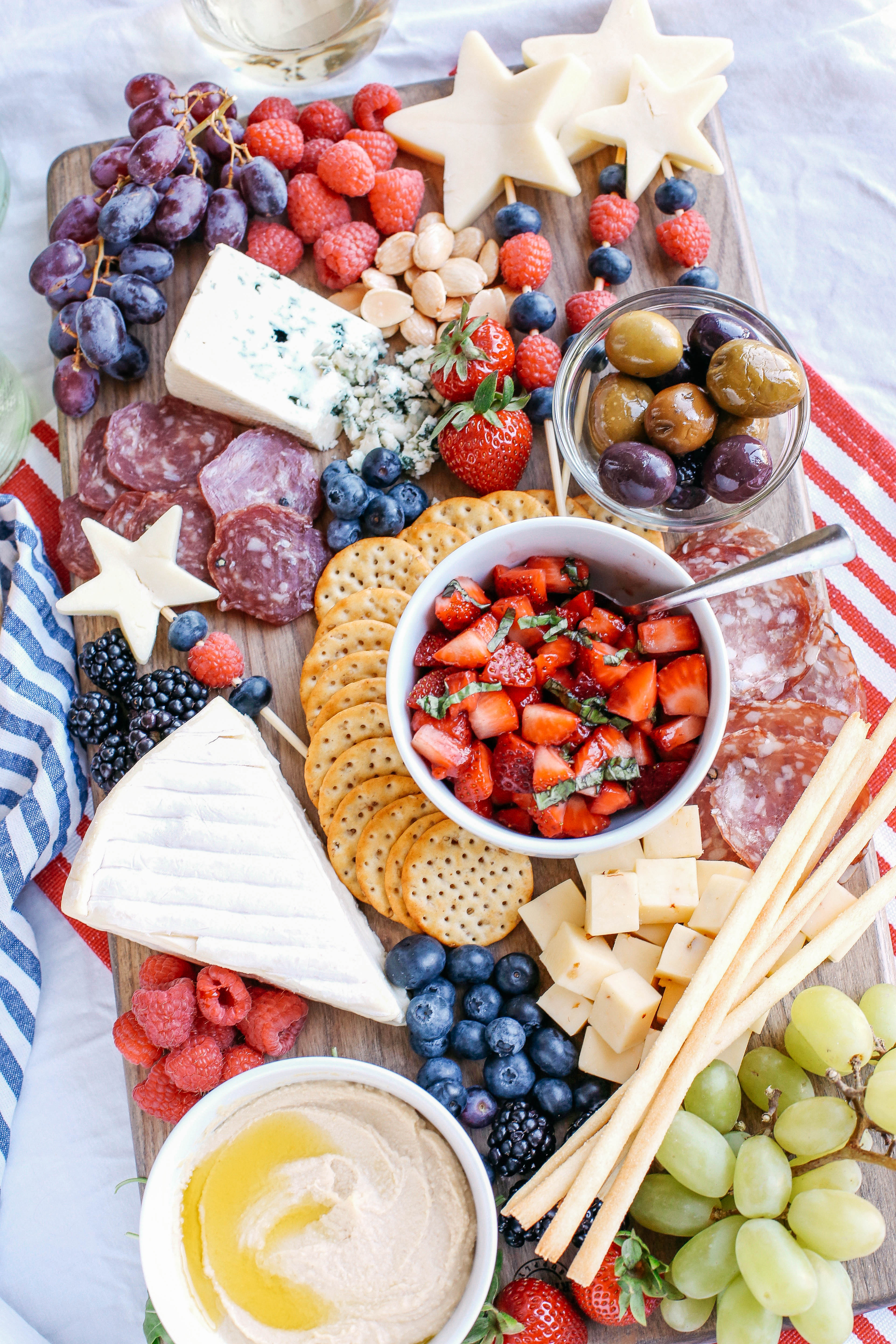 Memorial Day is right around the corner so kick off the summer with the Ultimate Patriotic Cheeseboard! Grab your favorite bottle of wine and share this festive appetizer with your friends and family this holiday!
