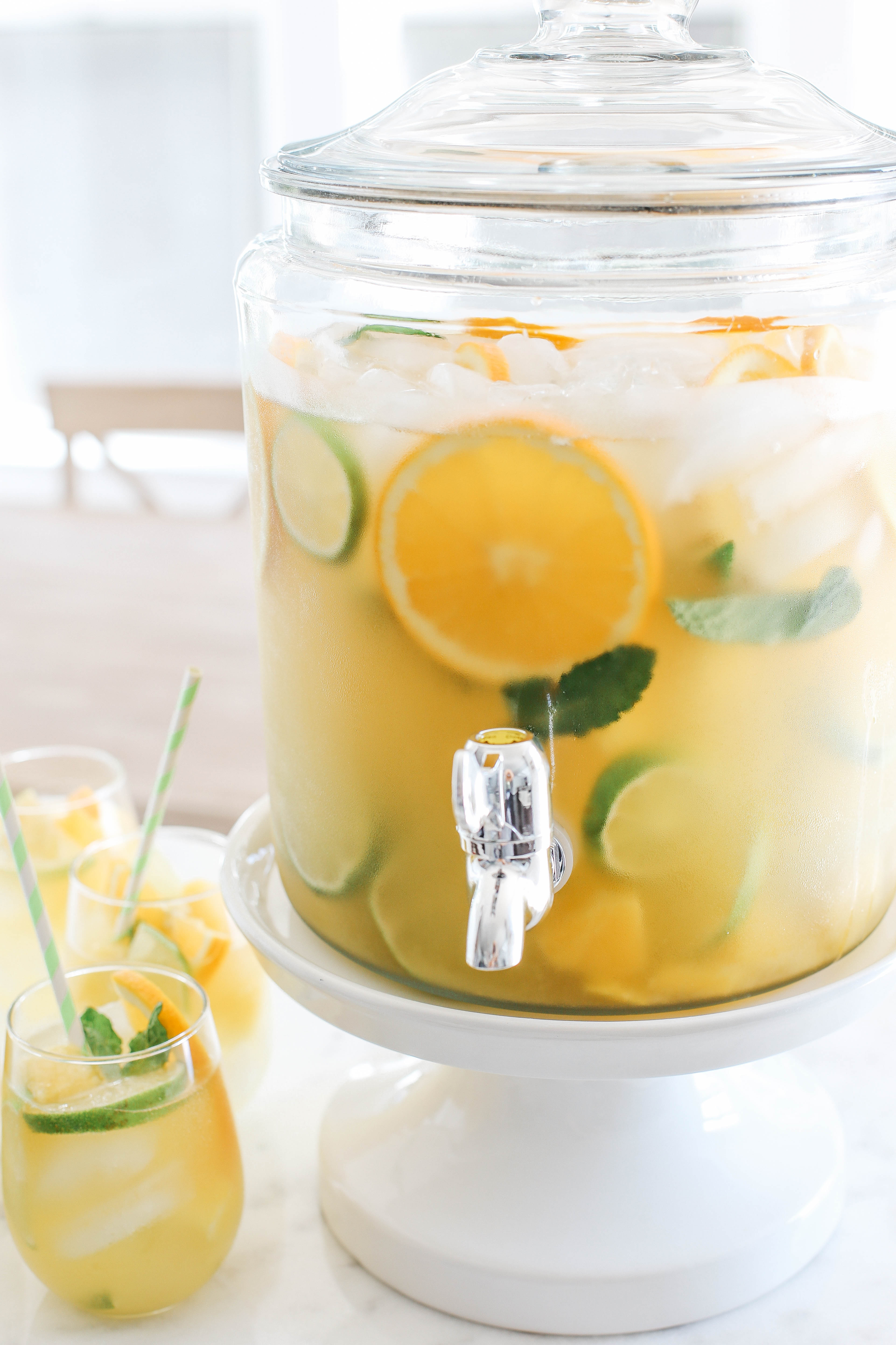 This Citrus Sangria combines all your favorite flavors of summer in one refreshing cocktail with a delicious mixture of fresh pineapple, oranges and limes all topped off with sparkling water!