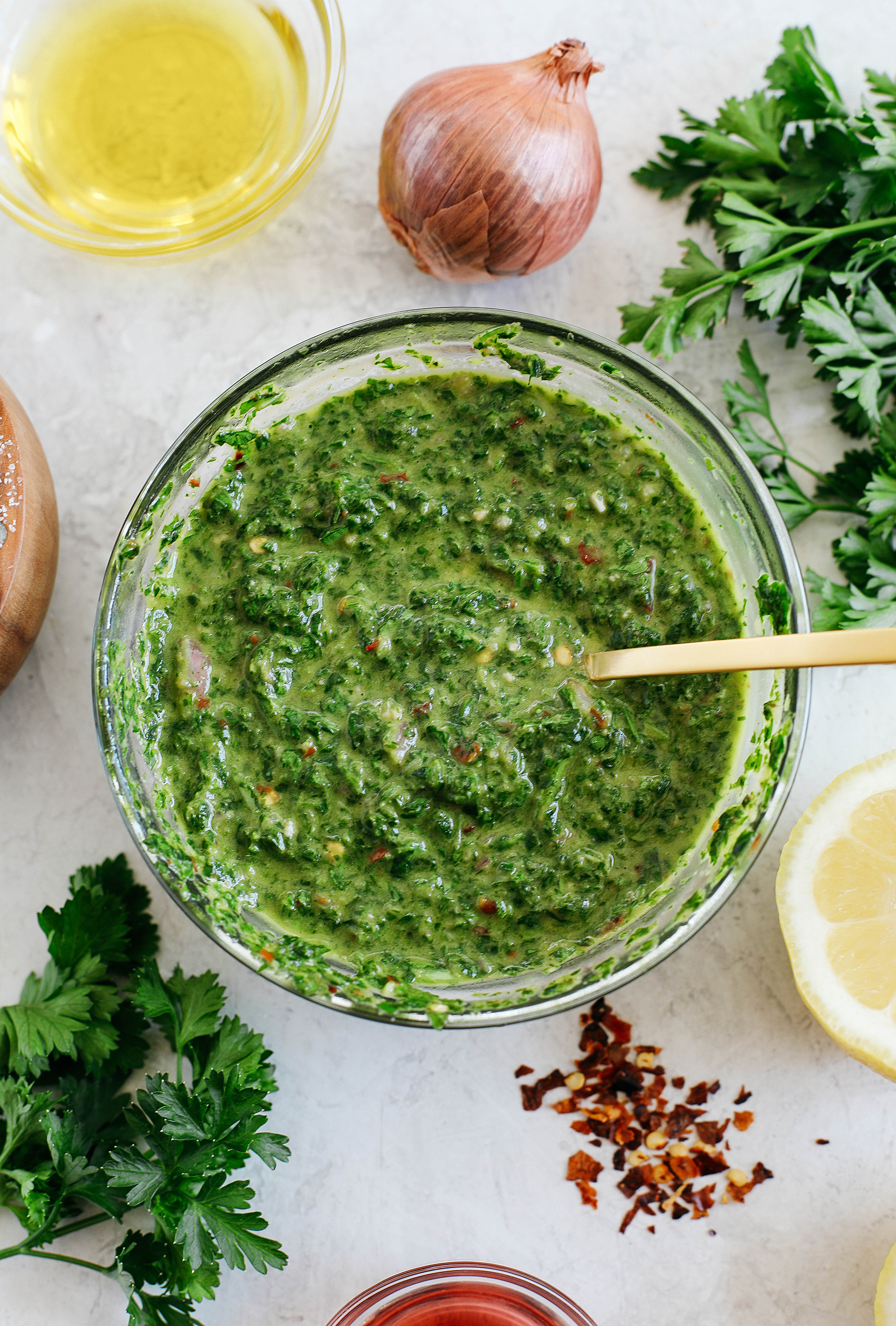 Quick and EASY Chimichurri Sauce perfect for grilling season that is healthy, flavorful and tastes delicious spooned over chicken, fish and even steak!