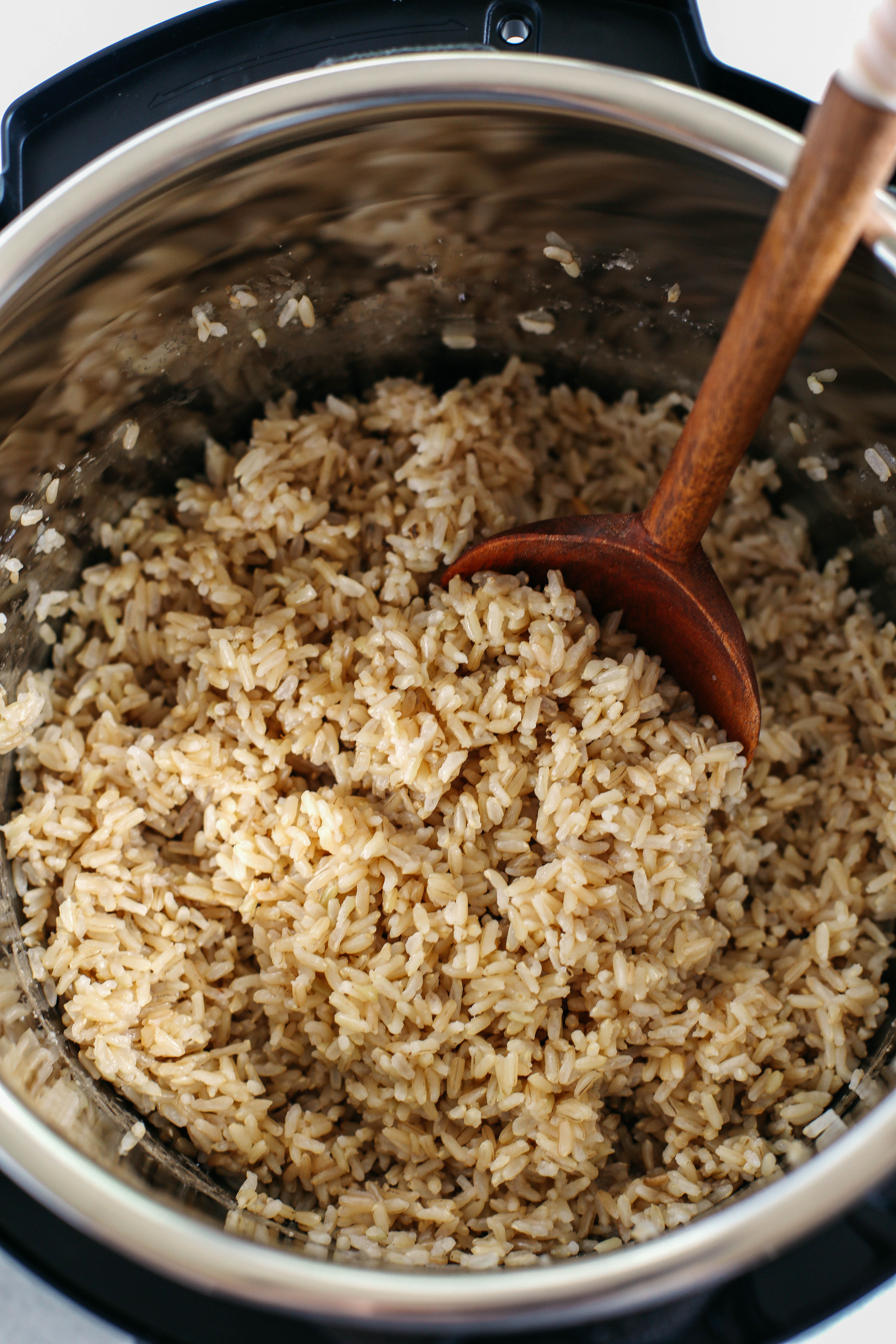 Perfectly cooked, fluffy brown rice EVERY TIME in about 30 minutes using the Instant Pot!  Hands down the easiest way to cook brown rice and perfect for meal prep!