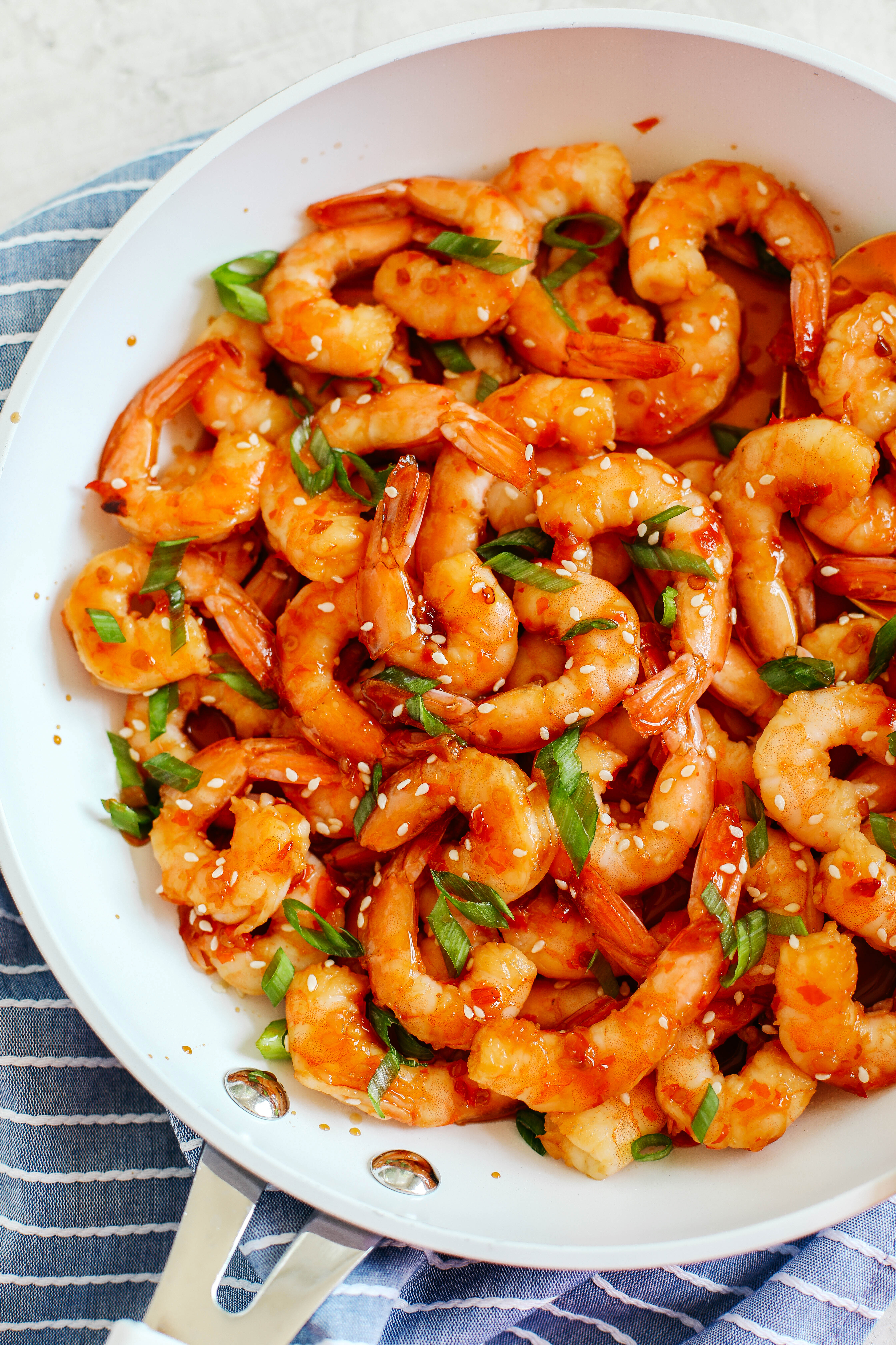 Sweet and flavorful Skillet Chili Garlic and Lime Shrimp that tastes amazing and is ready in just minutes!  Perfect as an appetizer, on top of a salad or even as a main dish!