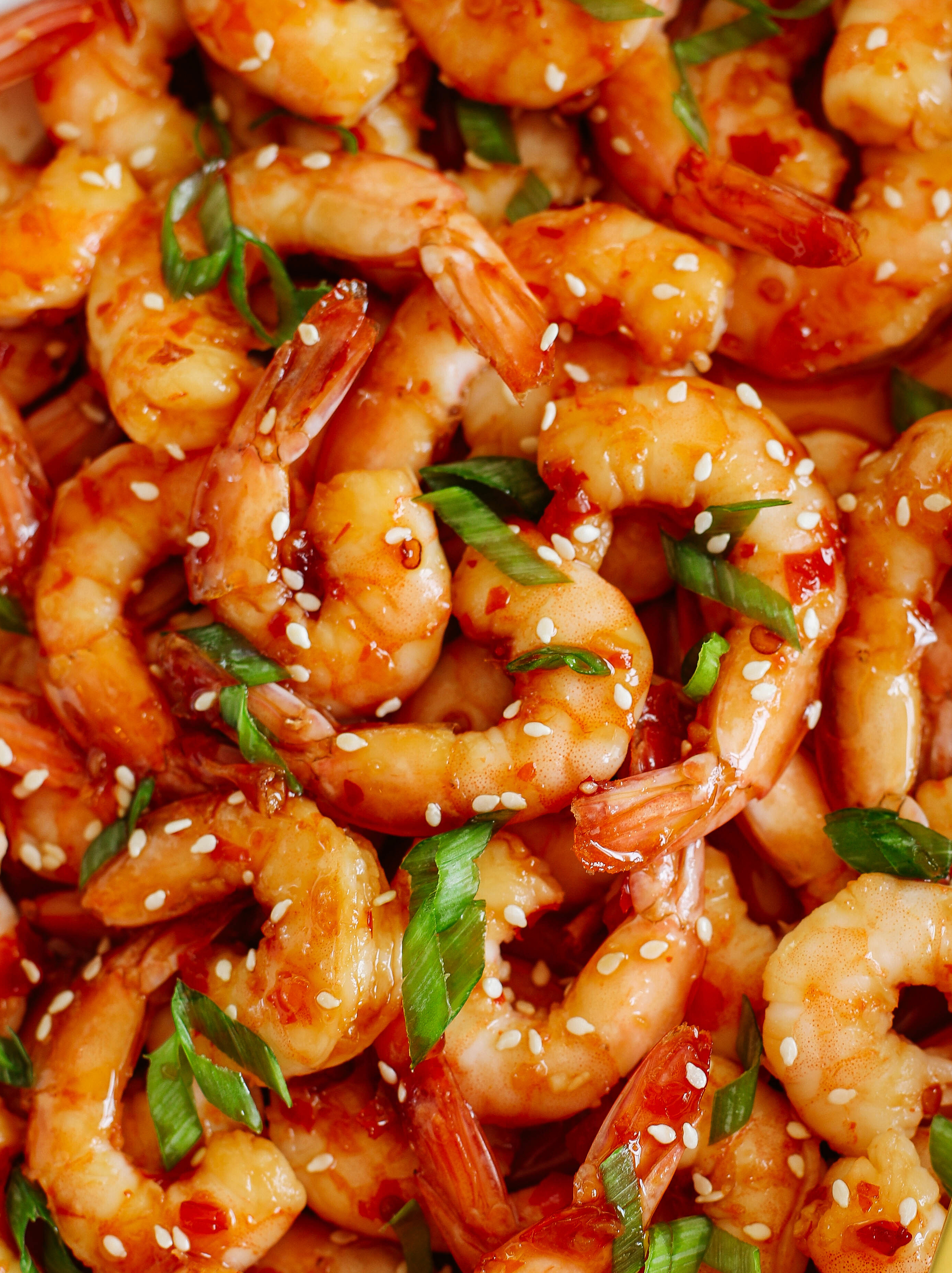 Sweet and flavorful Skillet Chili Garlic and Lime Shrimp that tastes amazing and is ready in just minutes!  Perfect as an appetizer, on top of a salad or even as a main dish!
