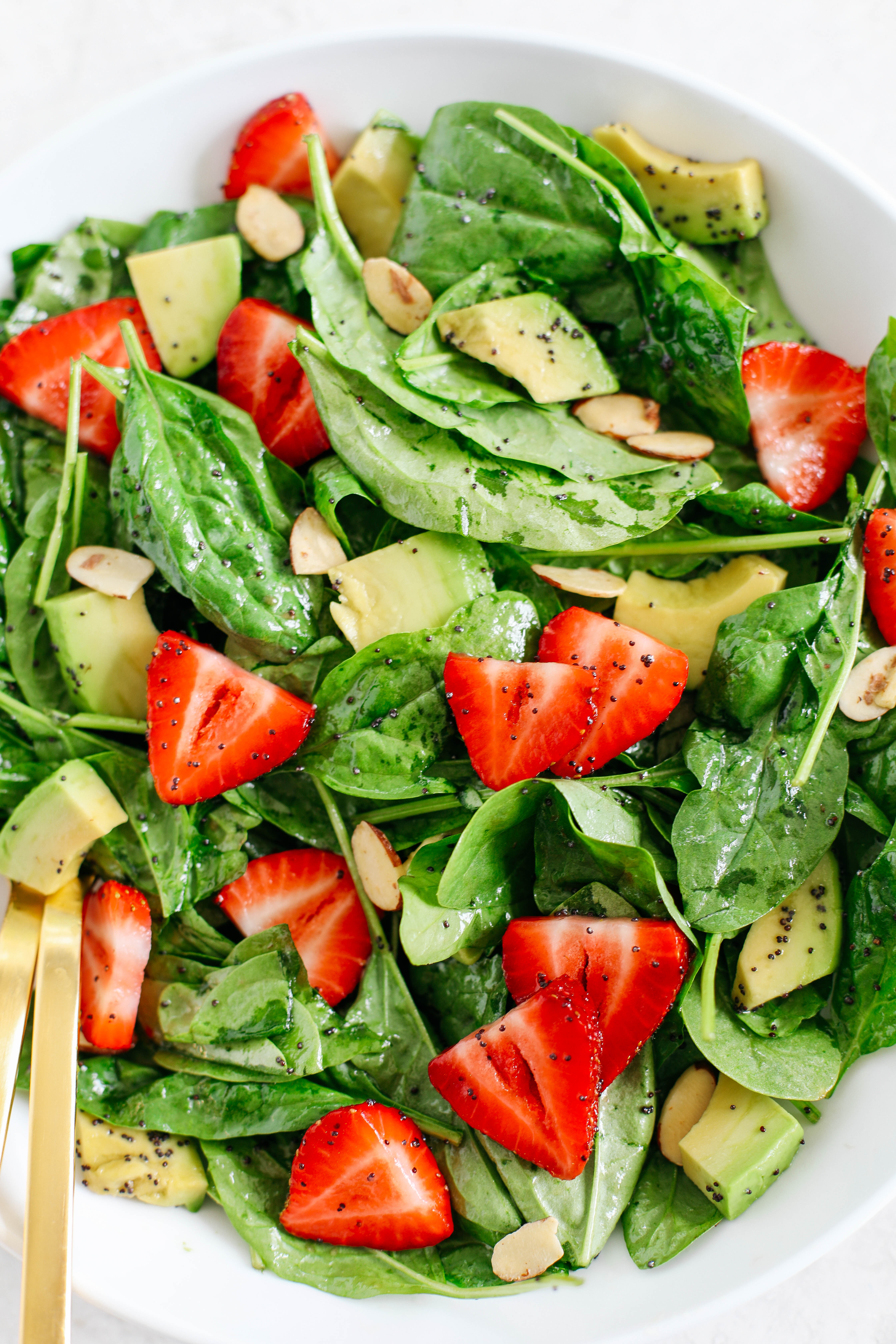 Super simple Strawberry Spinach Salad with Poppy Seed Dressing that is healthy, delicious and the perfect summer staple!