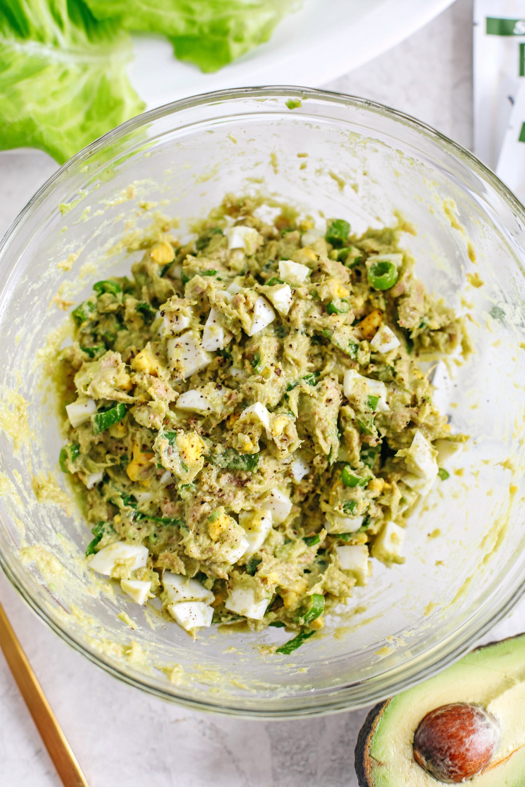 This 5-ingredient Tuna Avocado Egg Salad is fresh, delicious and only takes about 5 minutes to throw together for a healthy, protein-packed meal!  No mayo necessary!
