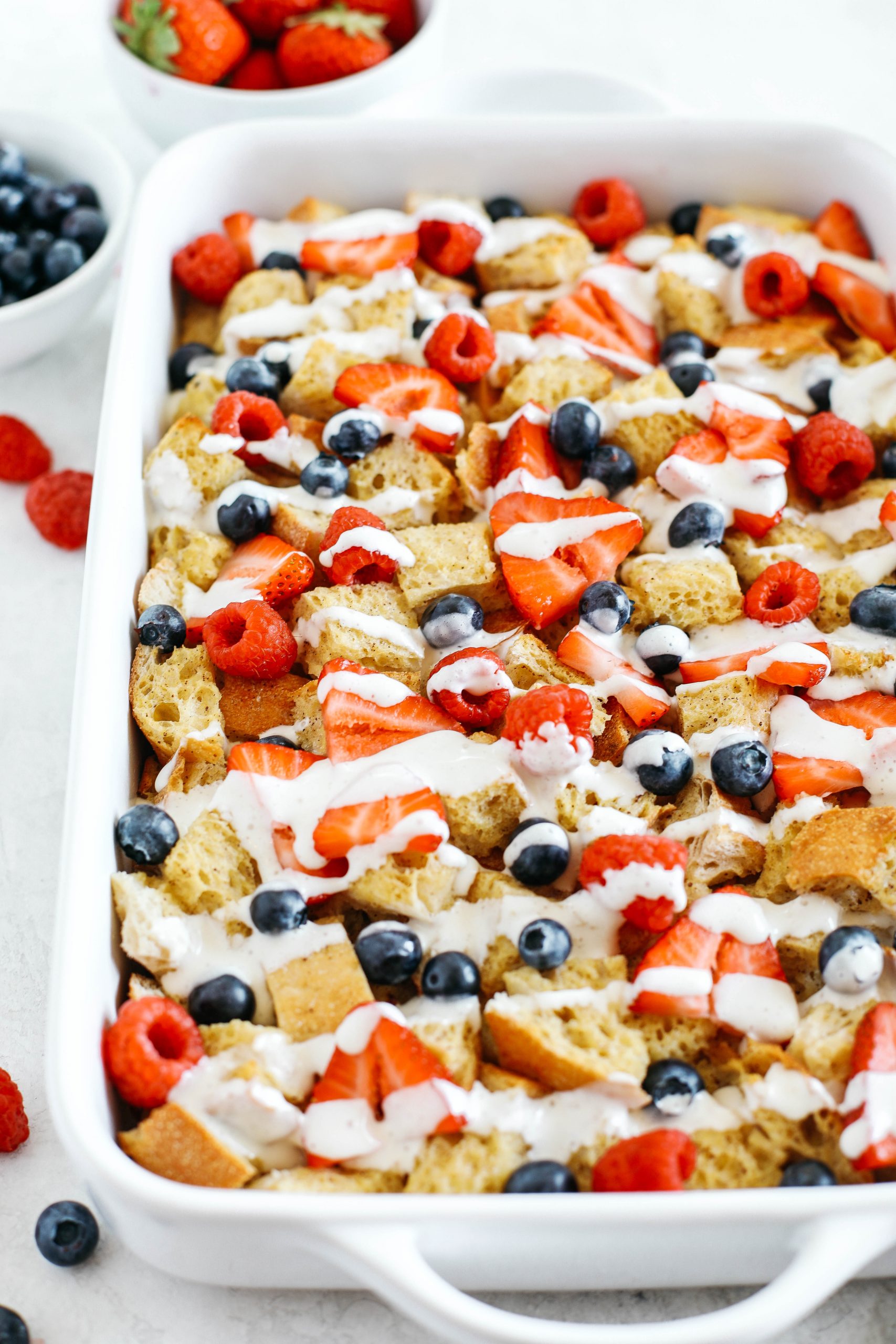 Warm and flavorful Mixed Berry French Toast Casserole with a delicious cream cheese drizzle that can easily be made the night before for the perfect morning breakfast!