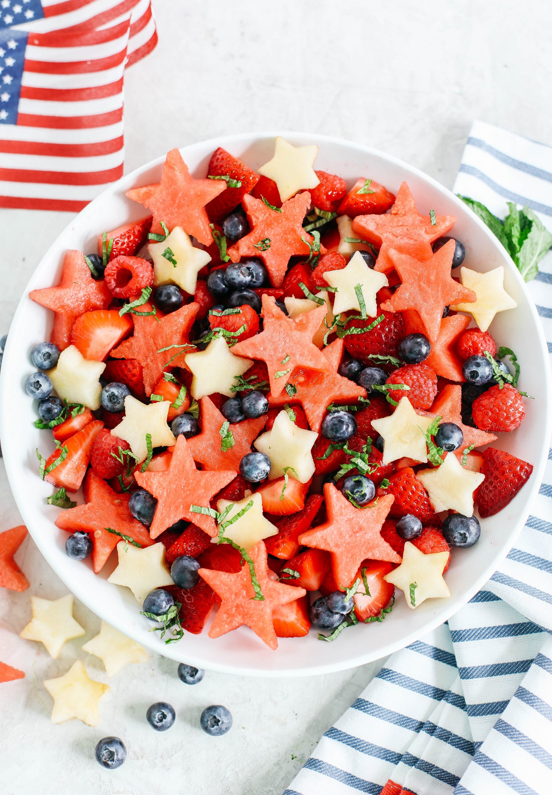 Kick off the 4th of July weekend with this fresh and festive Red, White and Blueberry Fruit Salad packed juicy watermelon, crisp apples and delicious berries all tossed together in a honey-citrus dressing!