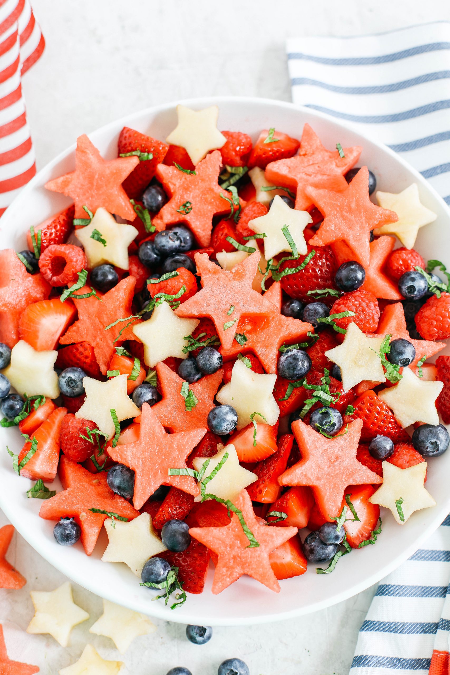 Kick off the 4th of July weekend with this fresh and festive Red, White and Blueberry Fruit Salad packed juicy watermelon, crisp apples and delicious berries all tossed together in a honey-citrus dressing!