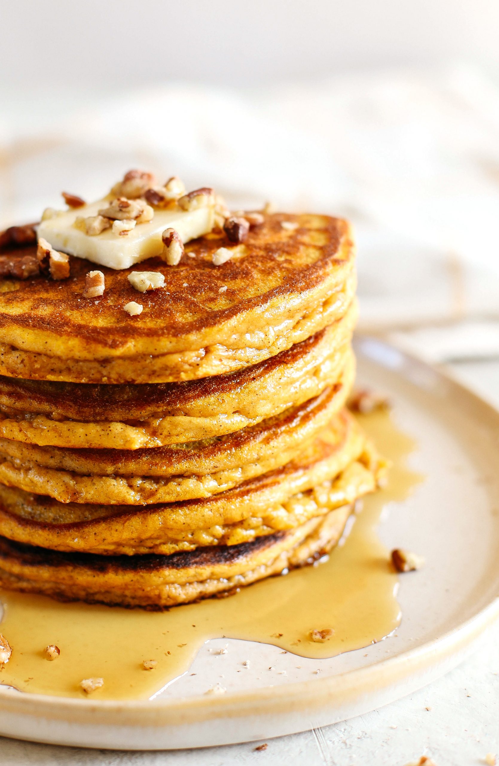 Start your morning with these fluffy pumpkin pancakes that are gluten-free, dairy-free and paleo with zero refined sugars made with almond flour for an easy delicious fall breakfast!