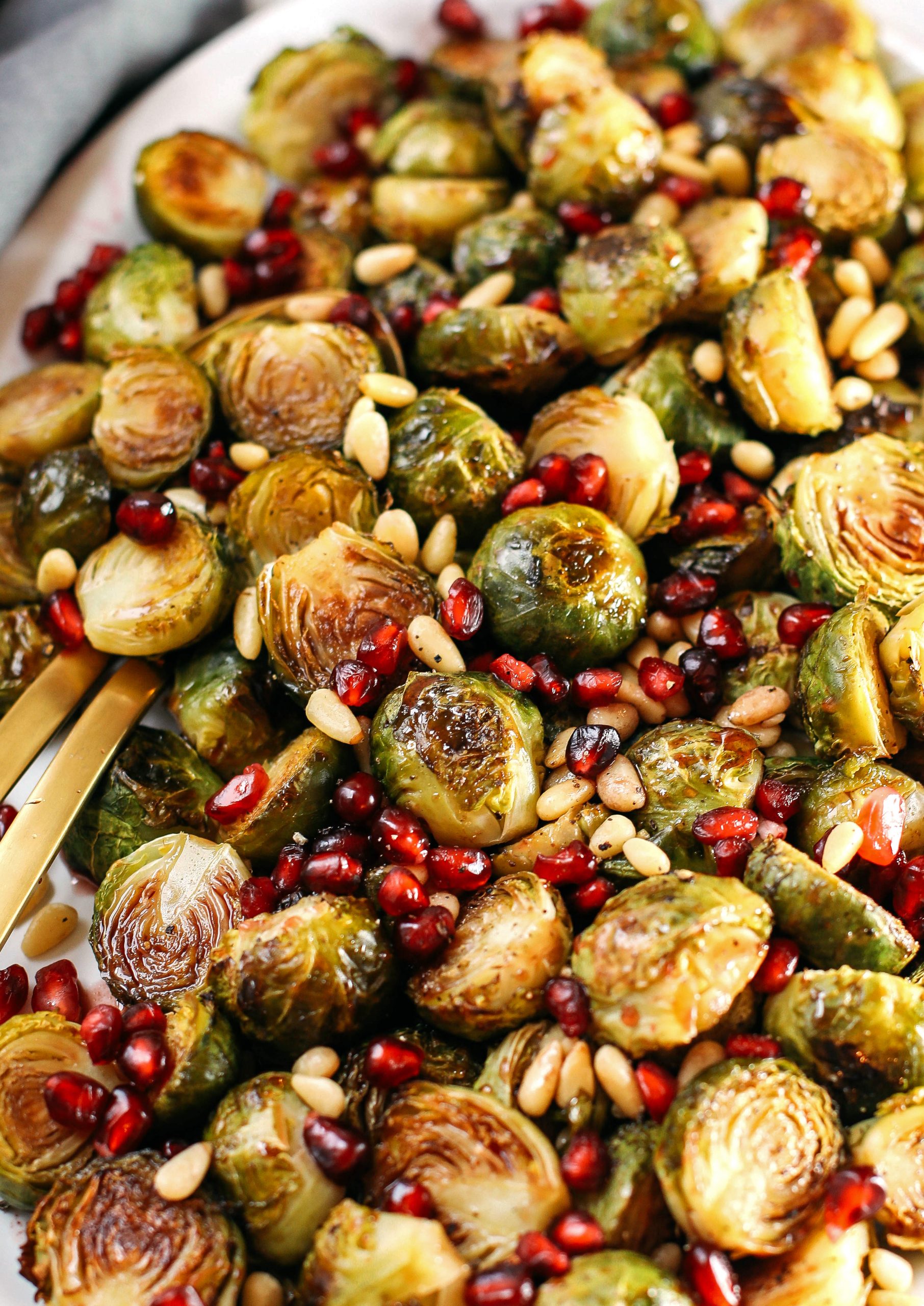 These Pomegranate Glazed Brussels Sprouts are savory, sweet and roasted to perfection making them the perfect holiday side dish for your table this season!