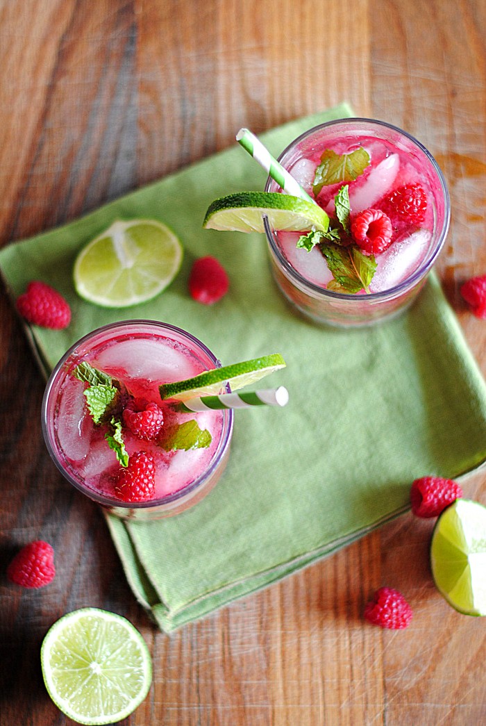 These delicious Raspberry Mint Mojitos are super easy to make, refreshingly delicious and make the perfect addition to your summer whether your sipping poolside or throwing a barbecue!