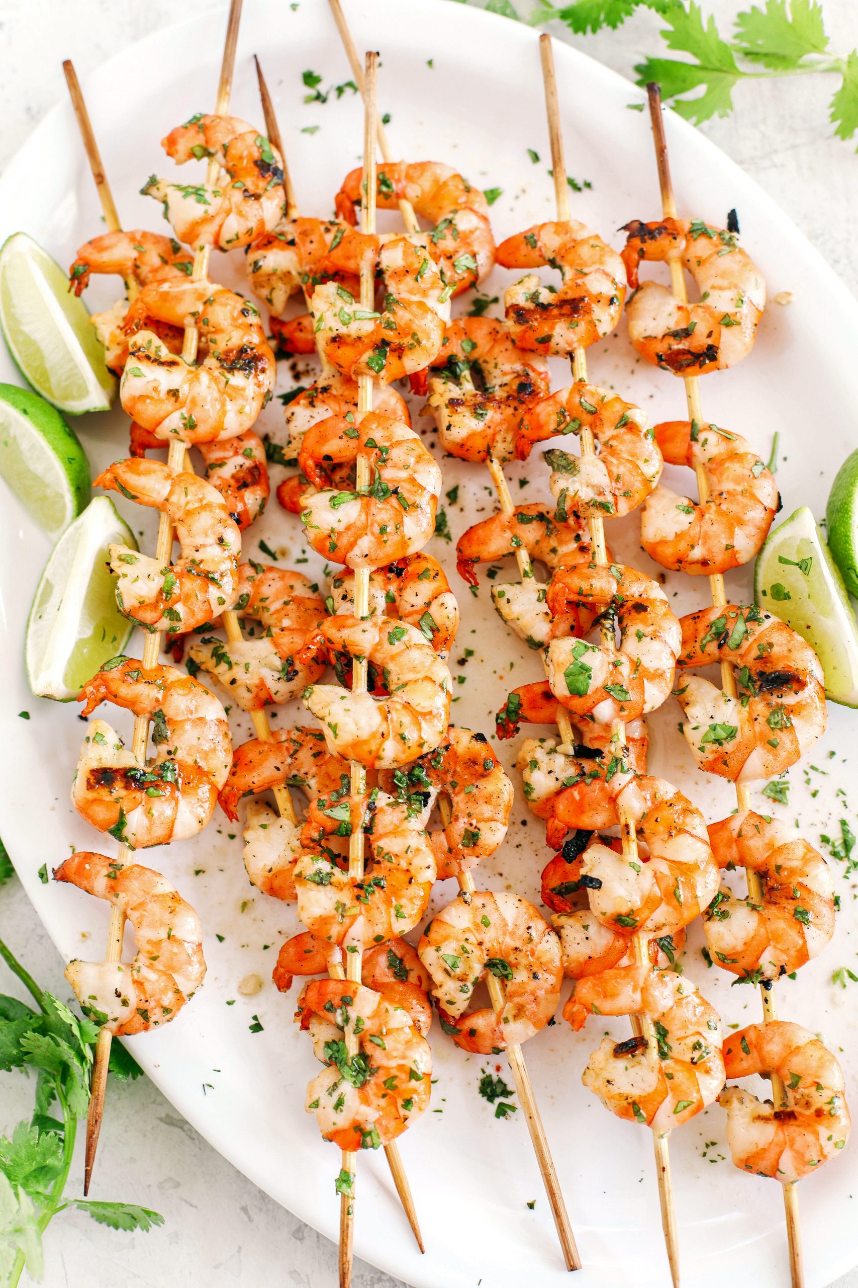 These Margarita Shrimp Skewers make the perfect summer meal that is light, healthy and marinated in garlic, fresh lime juice, cilantro and of course, tequila!  
