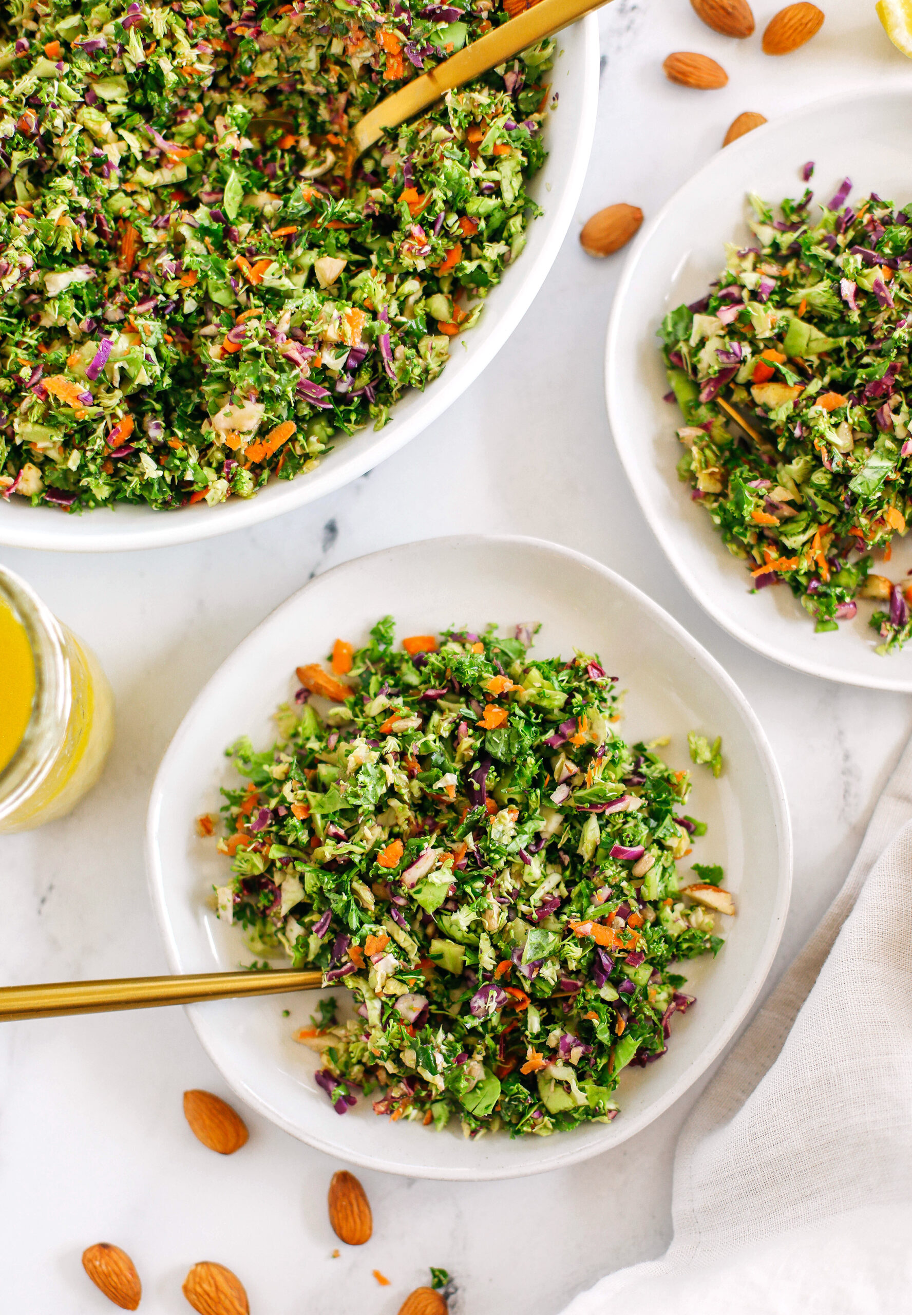 My FAVORITE Detox Salad that is healthy and loaded with fresh veggies like brussels sprouts, broccoli, kale and cabbage all drizzled with a lemony ginger dressing!  This salad makes a ton to last you all week!