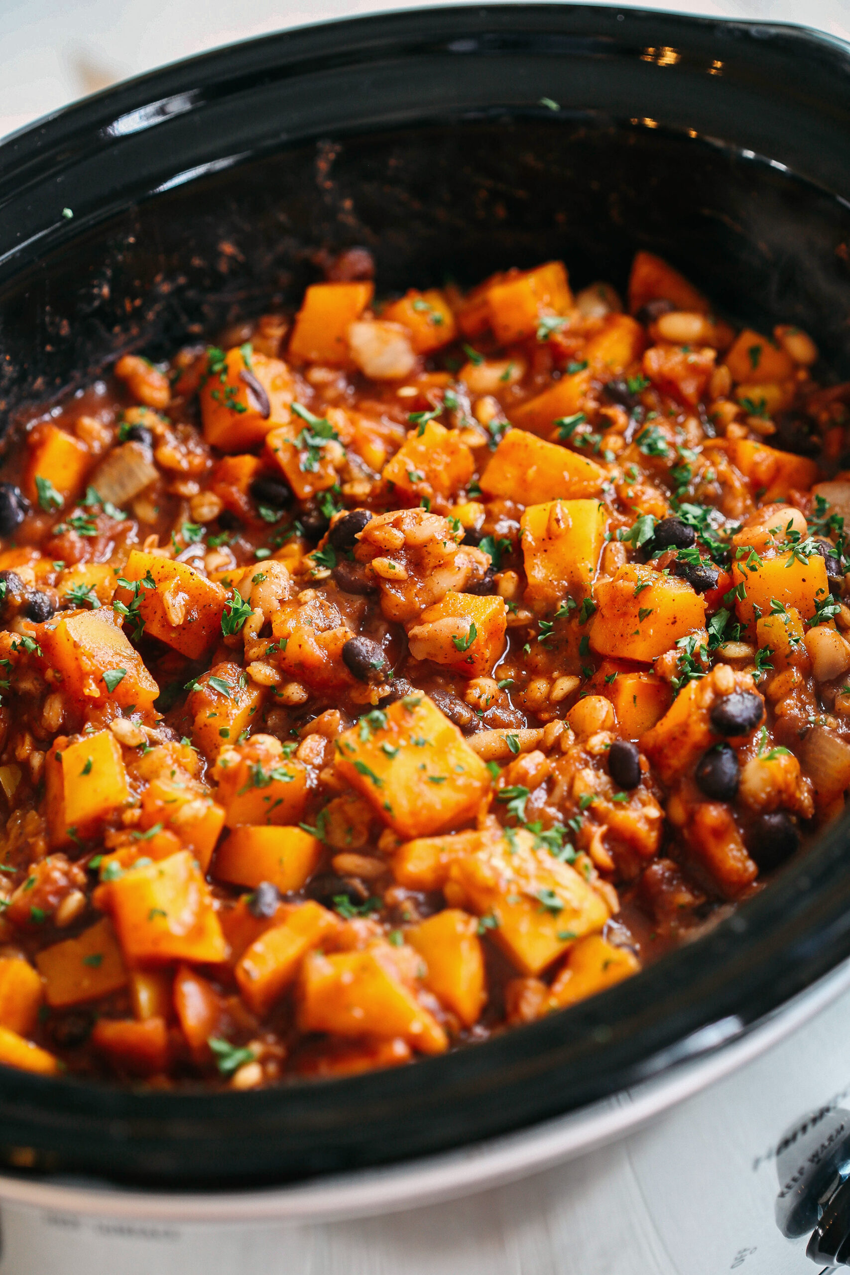 This slow-cooking pumpkin and Farro pepper is filling, healthy, and loaded with seasonal vegetables, tender farro, protein-packed beans, and cozy spices, all simmered in a delicious broth for the perfect fall meal!