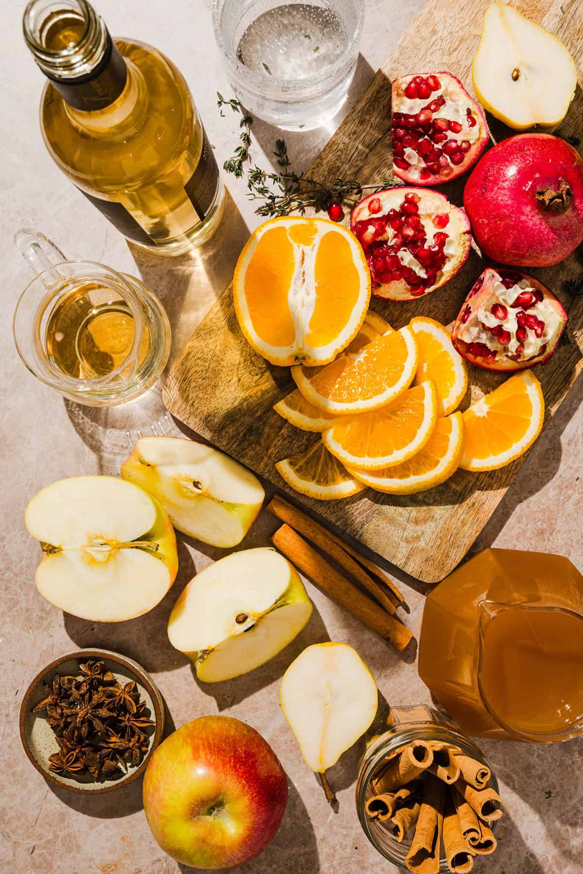Fresh apples, oranges, pears and pomegranates along with the rest of the ingredients for the fall harvest sangria