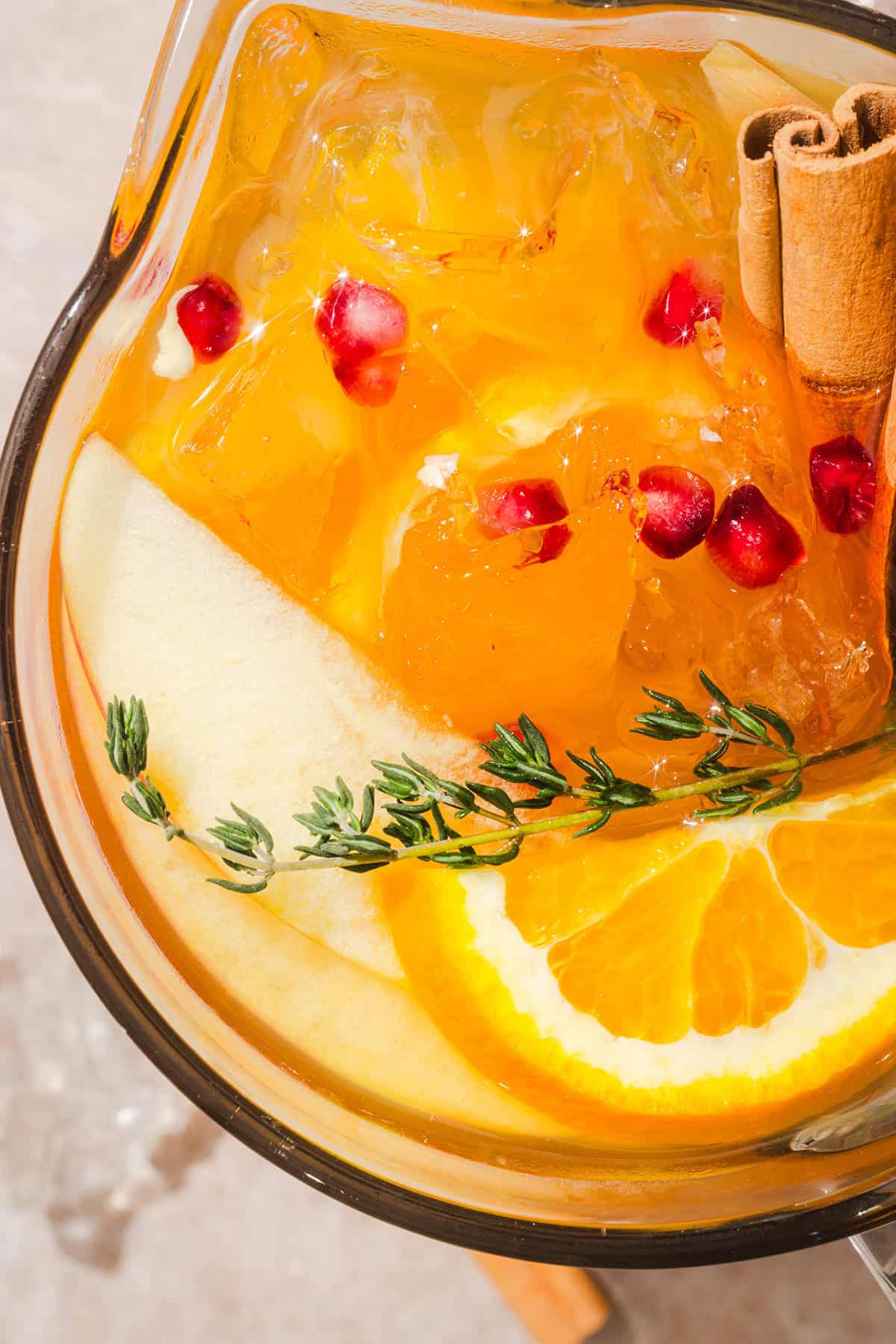 Pitcher of fall harvest sangria with white wine, apple cider and sliced fall fruit
