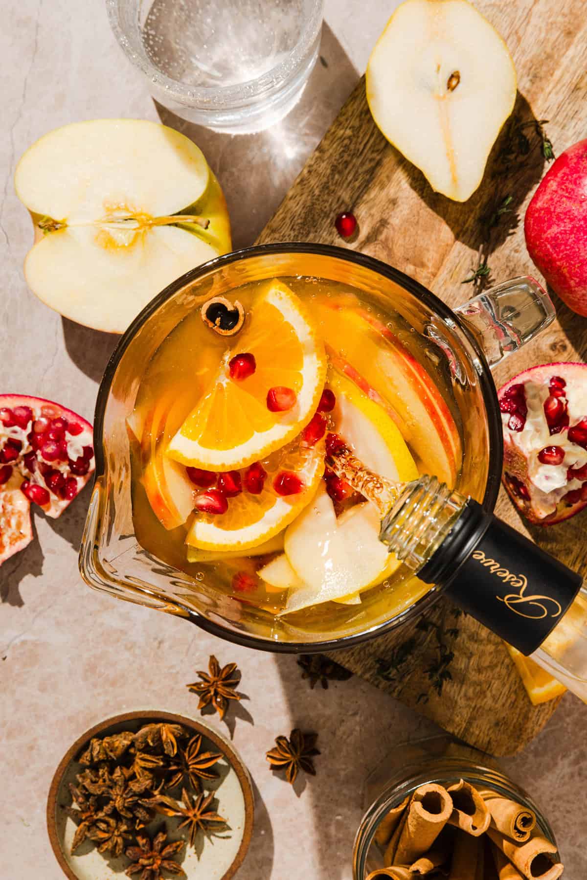 Pitcher of fall harvest sangria with white wine, apple cider and sliced fall fruit