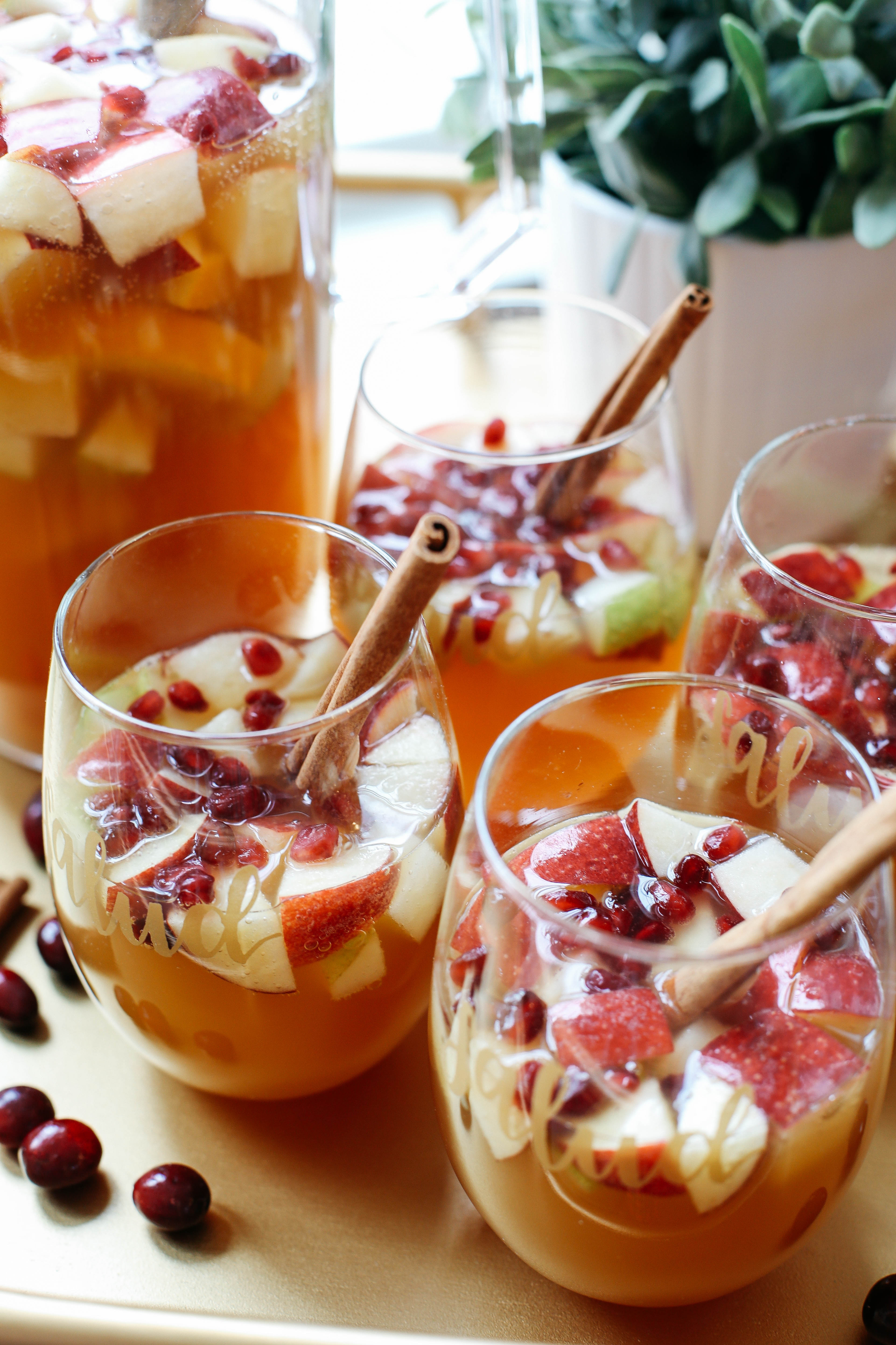This Fall Harvest Sangria is the perfect holiday cocktail filled with crisp apples, pears, cranberries, cinnamon sticks and fresh apple cider!