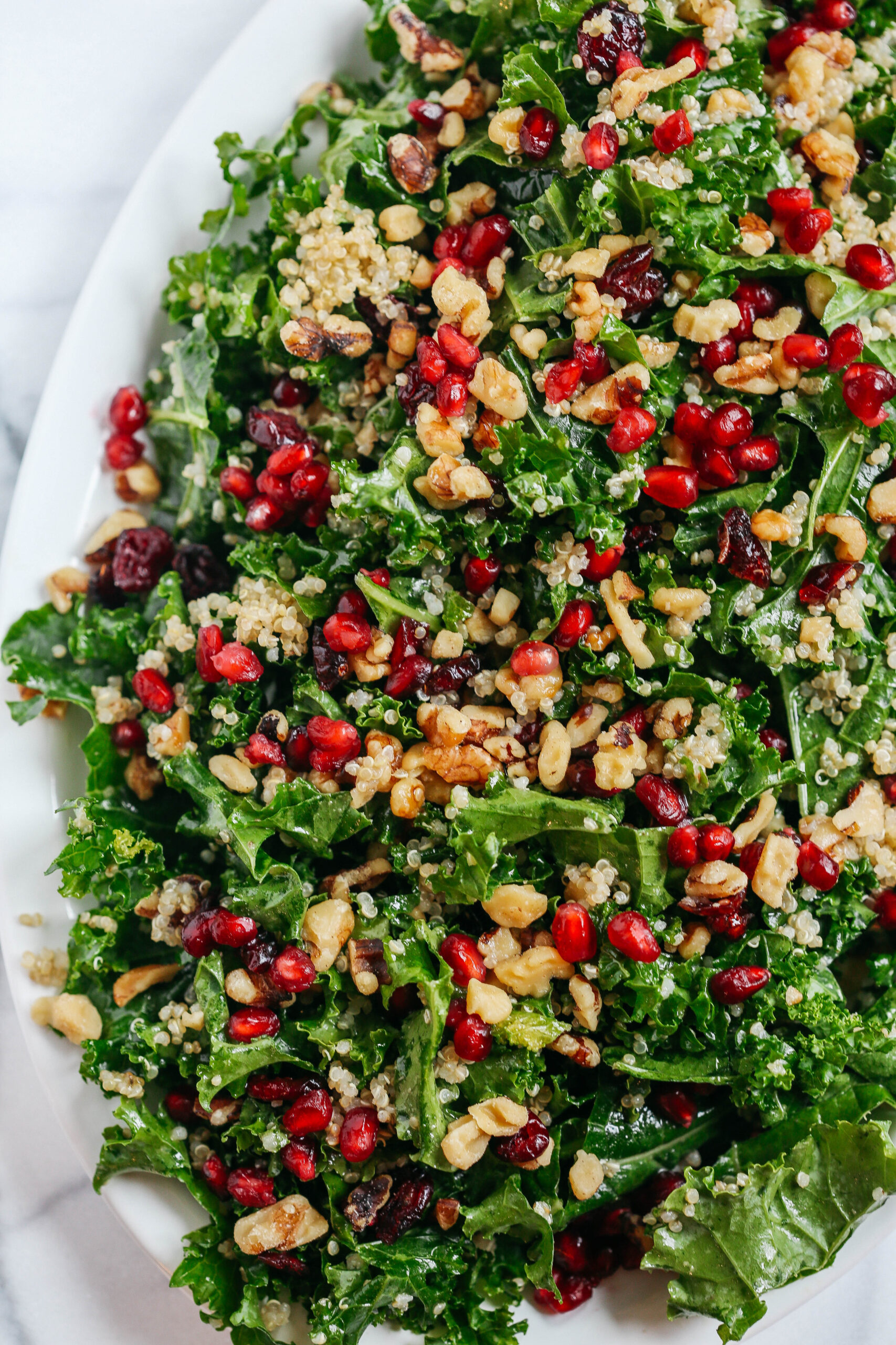 This Winter Kale and Quinoa Salad makes the perfect healthy holiday side dish that is sweet, crunchy and super easy to make!