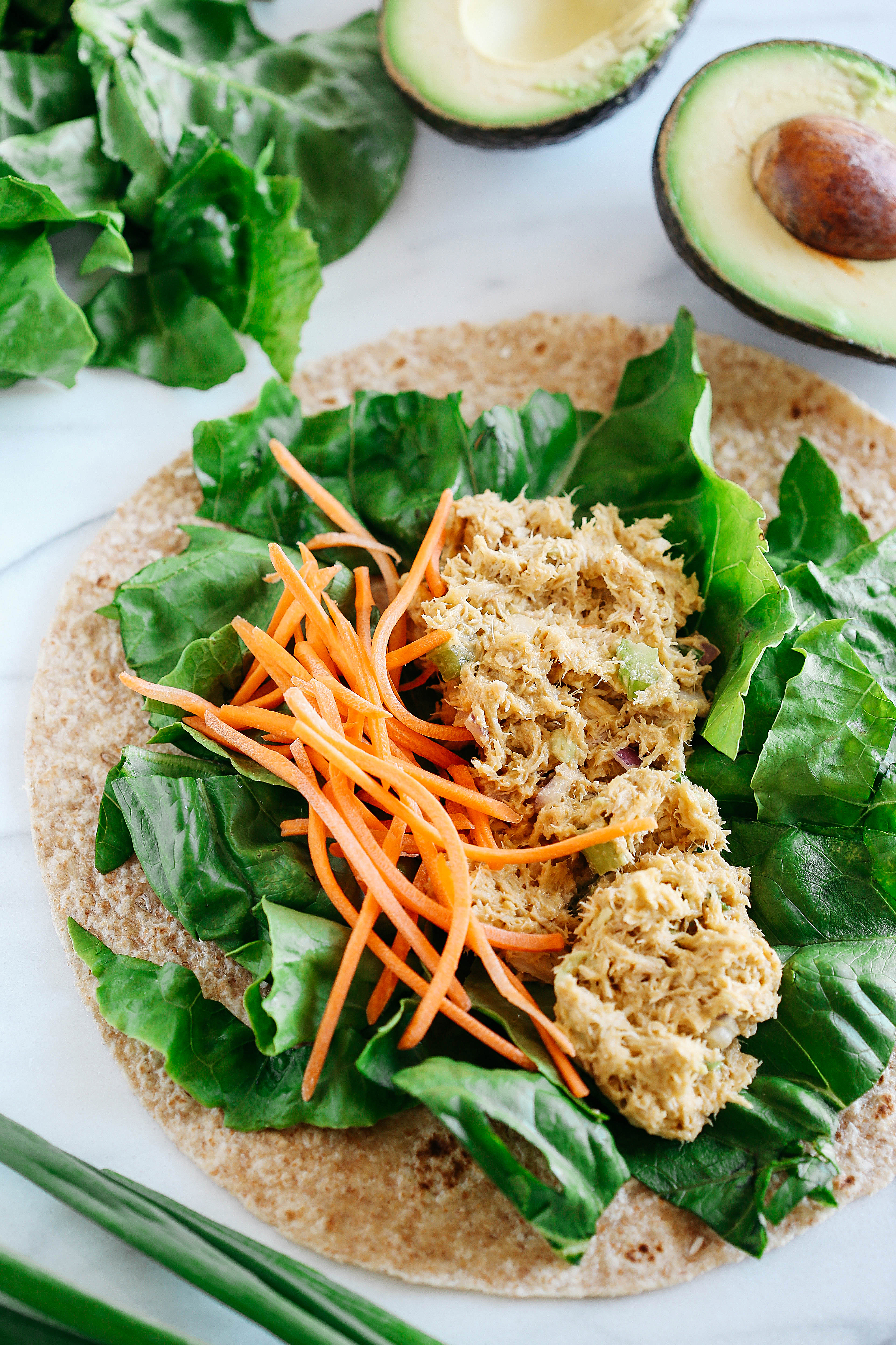 These Spicy Tuna Avocado Wraps are light and fresh, full of flavor and only take 5 minutes to make! The perfect healthy lunch for a busy work week!