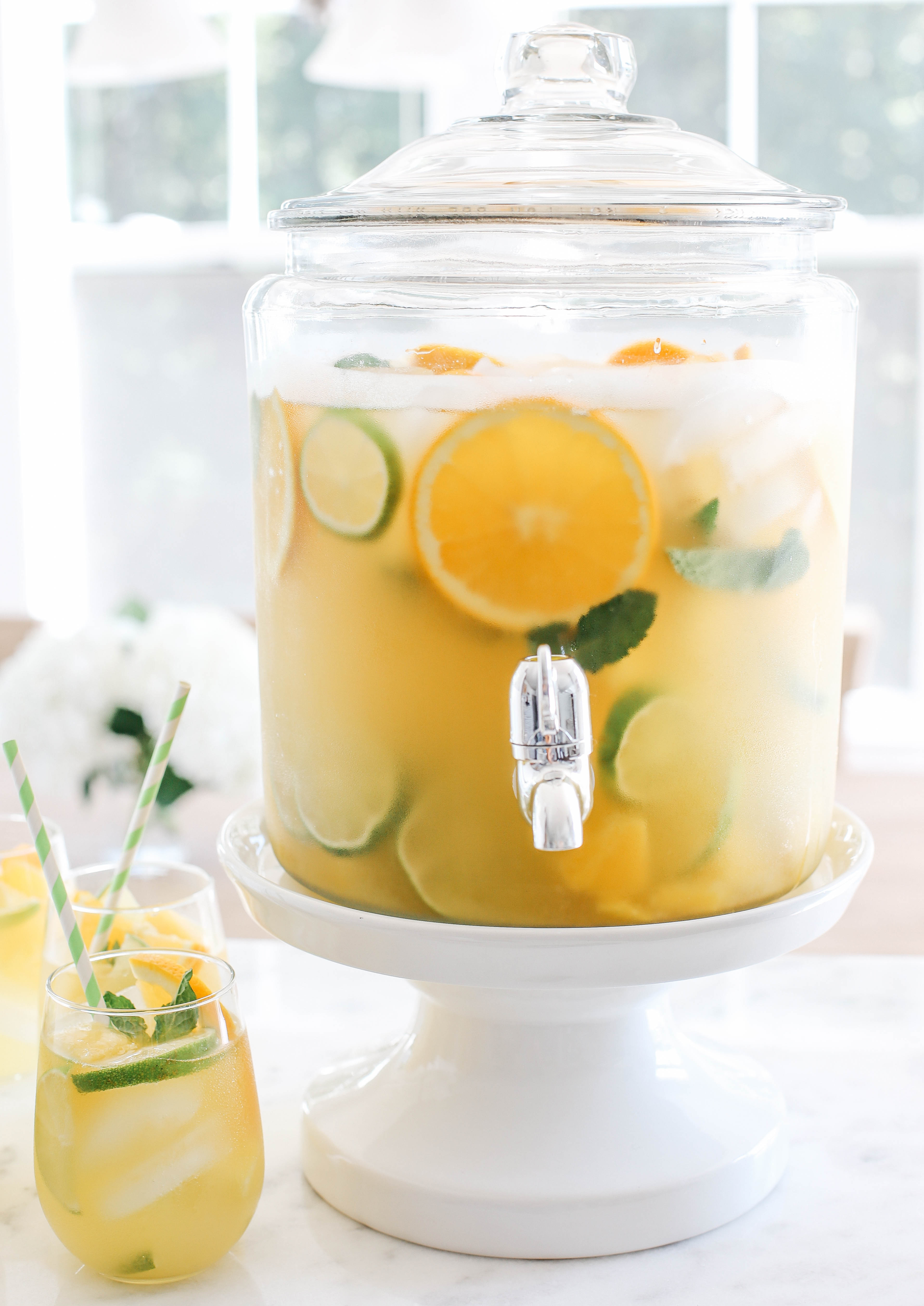 This Citrus Sangria combines all your favorite flavors of summer in one refreshing cocktail with a delicious mixture of fresh pineapple, oranges and limes all topped off with sparkling water!
