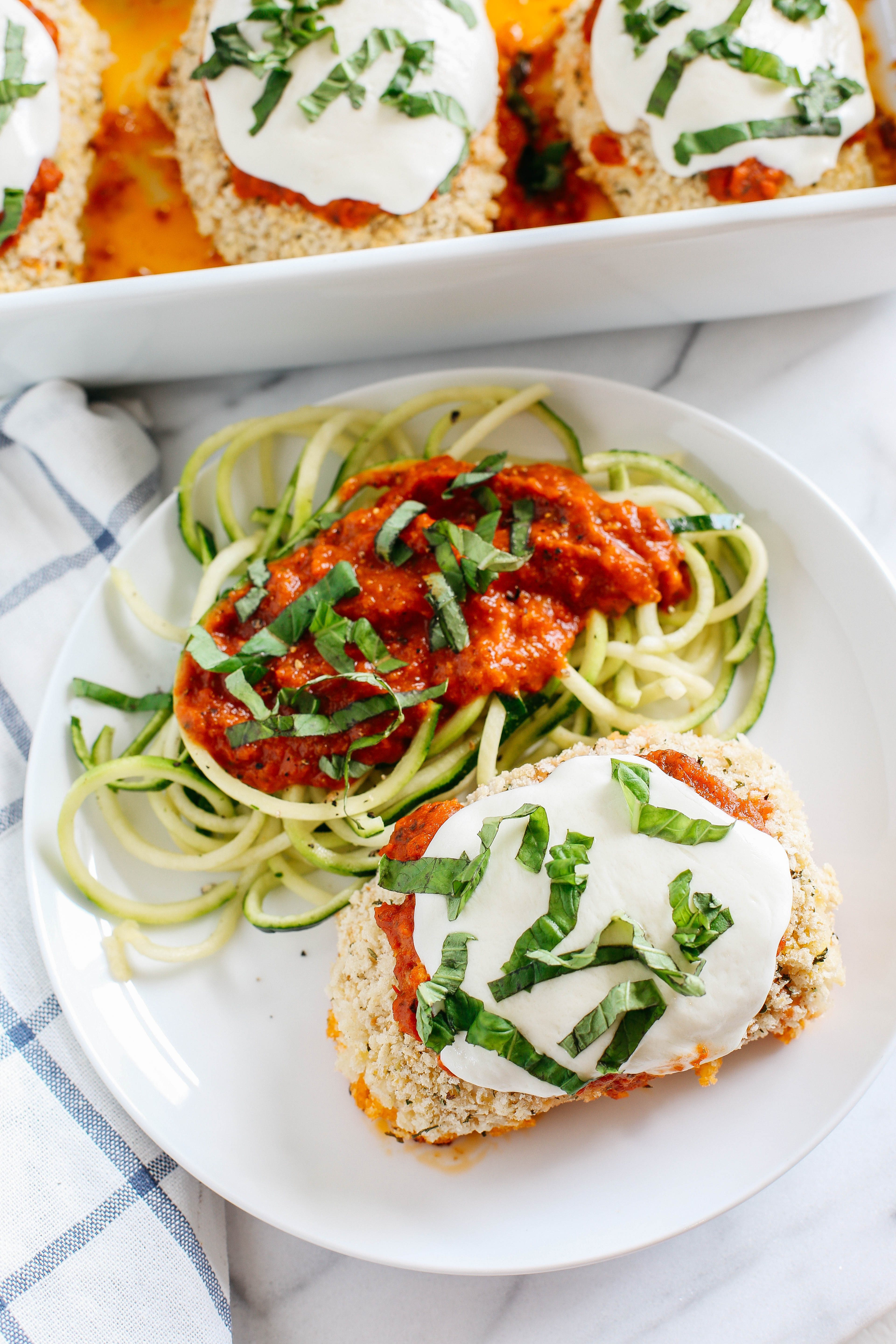 This recipe for Sun Dried Tomato Pesto Chicken Rolls makes the perfect weeknight comfort meal that is cheesy and delicious with even tastier leftovers!  Serve with zucchini noodles for a complete meal!
