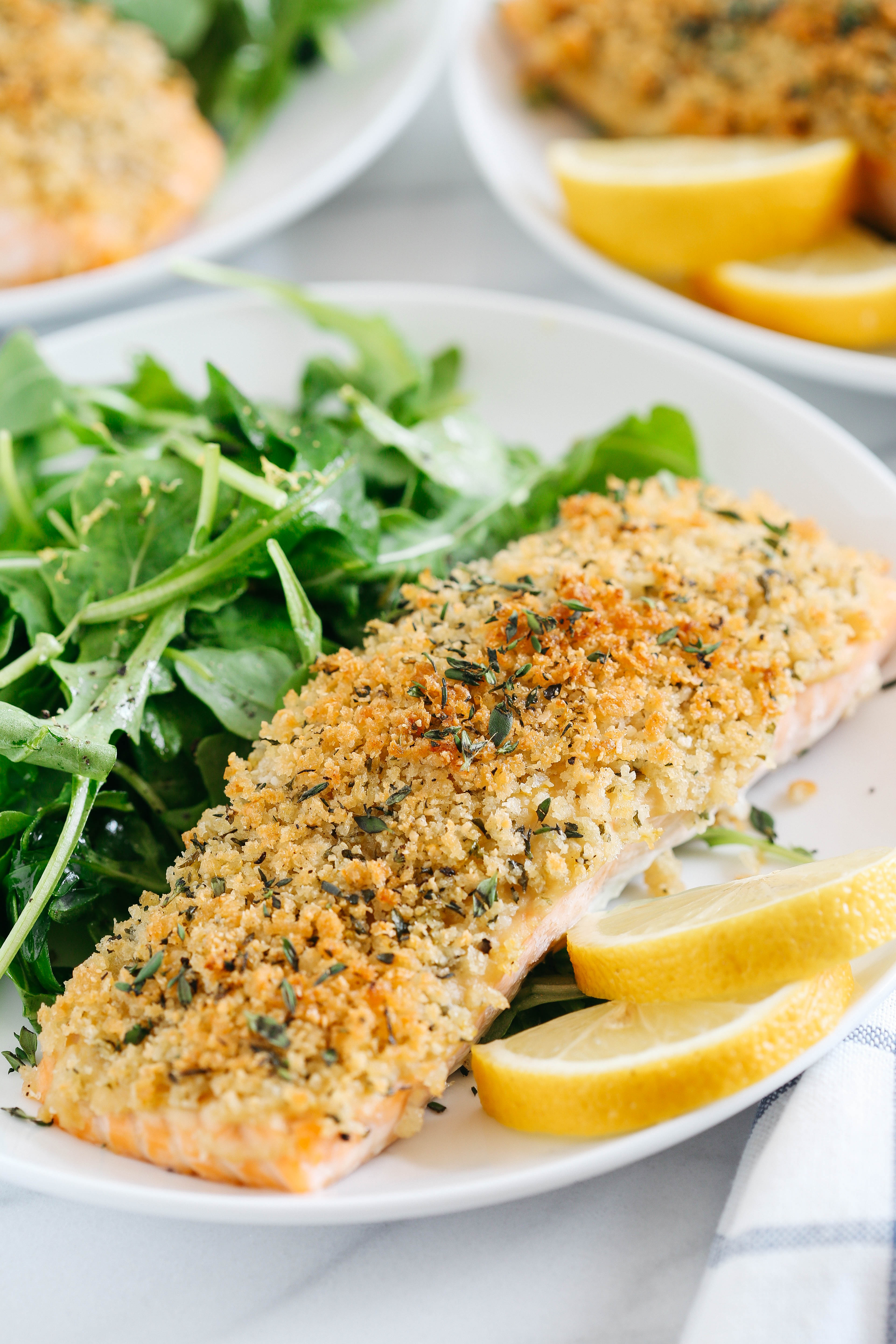 Hummus Crusted Salmon baked to perfection and served with a delicious Lemon Arugula Salad for the perfect healthy weeknight meal ready in under 30 minutes!