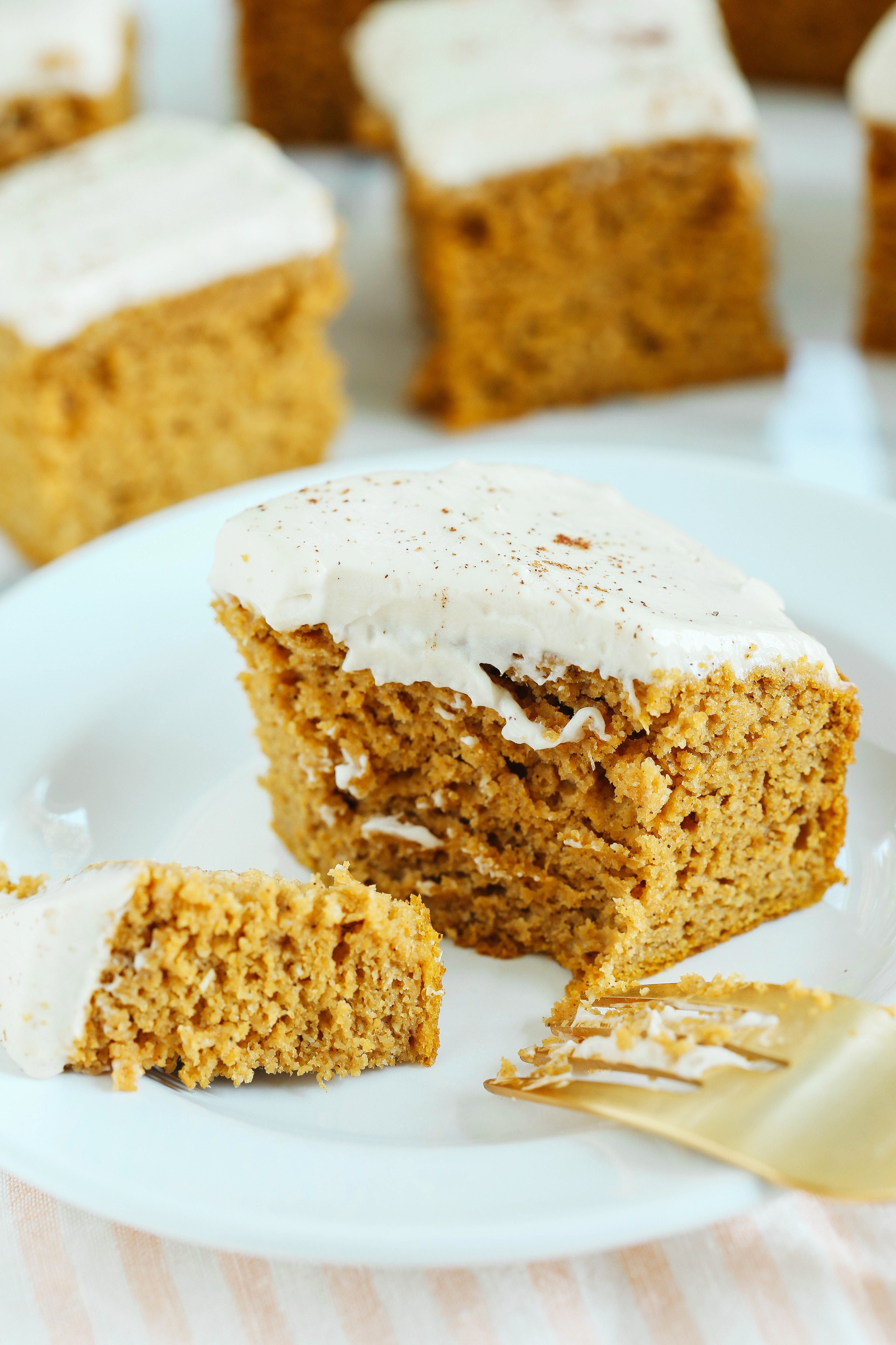 Kick off the fall season with these Healthier Pumpkin Bars with Cream Cheese Frosting that are moist, delicious and taste just like cake, but without any butter or refined sugar!