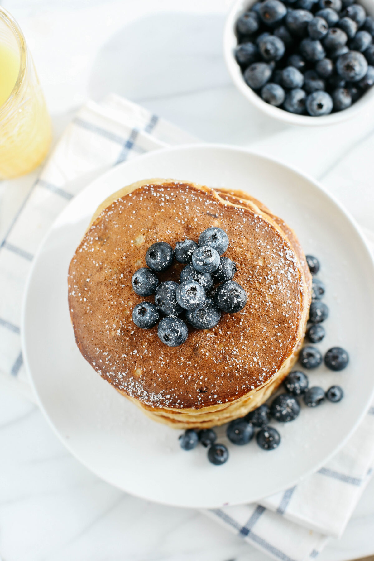 Start your morning with these fluffy blueberry banana pancakes that are grain-free, gluten-free and refined sugar-free made with almond flour for an easy delicious breakfast!