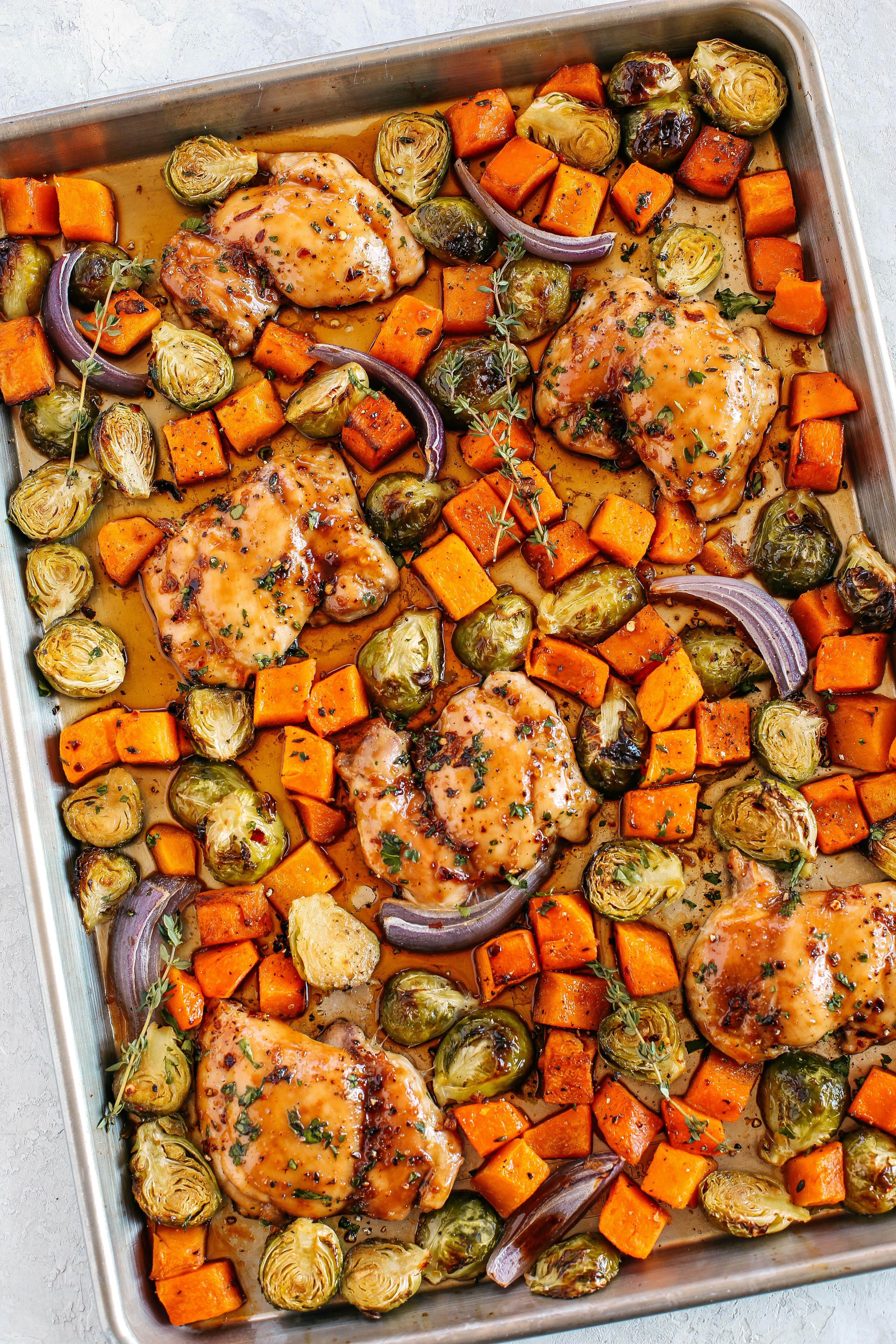 This Sheet Pan Ginger Maple Chicken with Brussels Sprouts and Butternut Squash makes the perfect weeknight dinner that’s healthy, delicious and easily made all on one pan in under 30 minutes!  