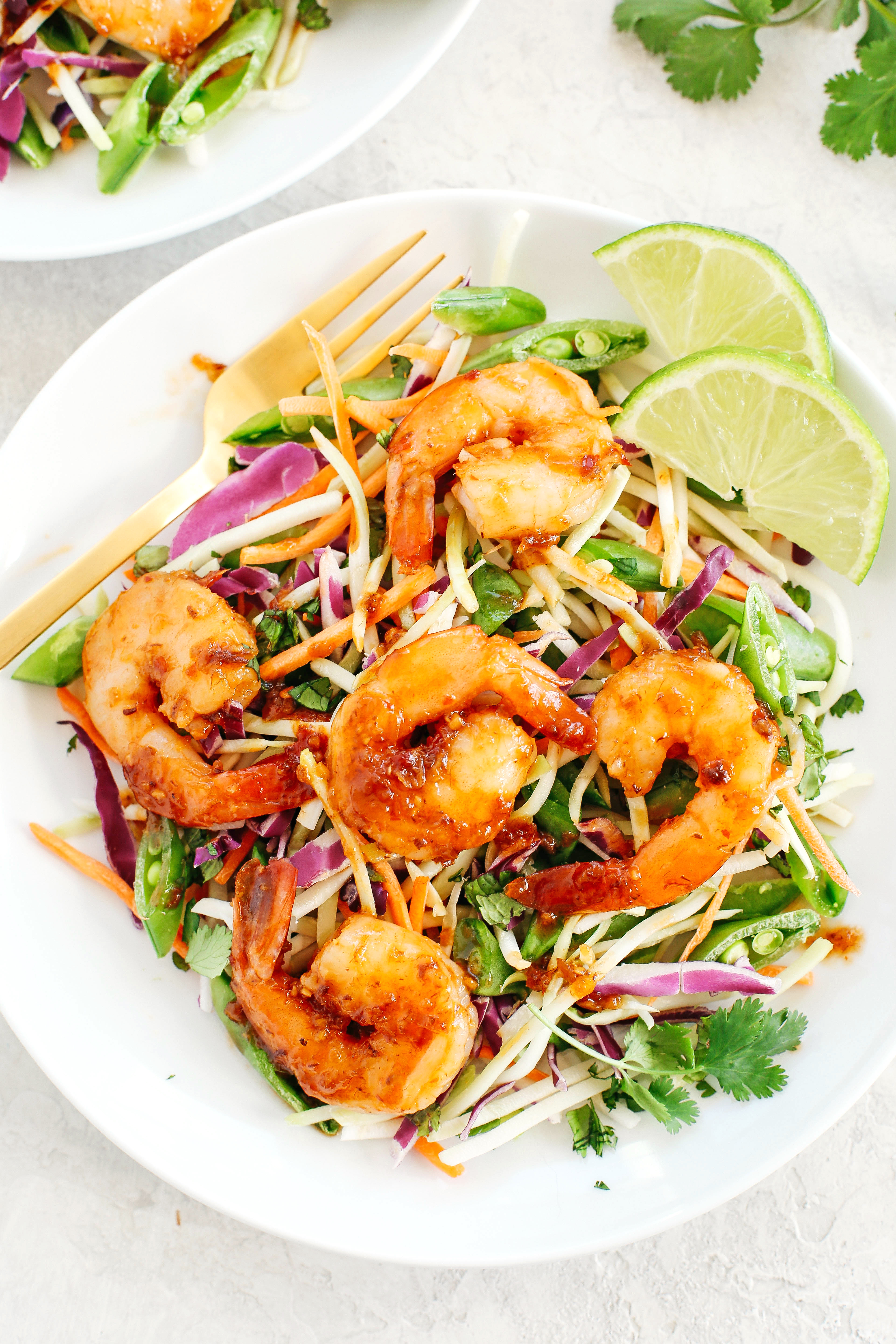 This quick and EASY Asian Shrimp Salad with Ginger Sesame Dressing is complete with all your favorite flavors, crunchy veggies and fresh herbs that can be easily made in just minutes!