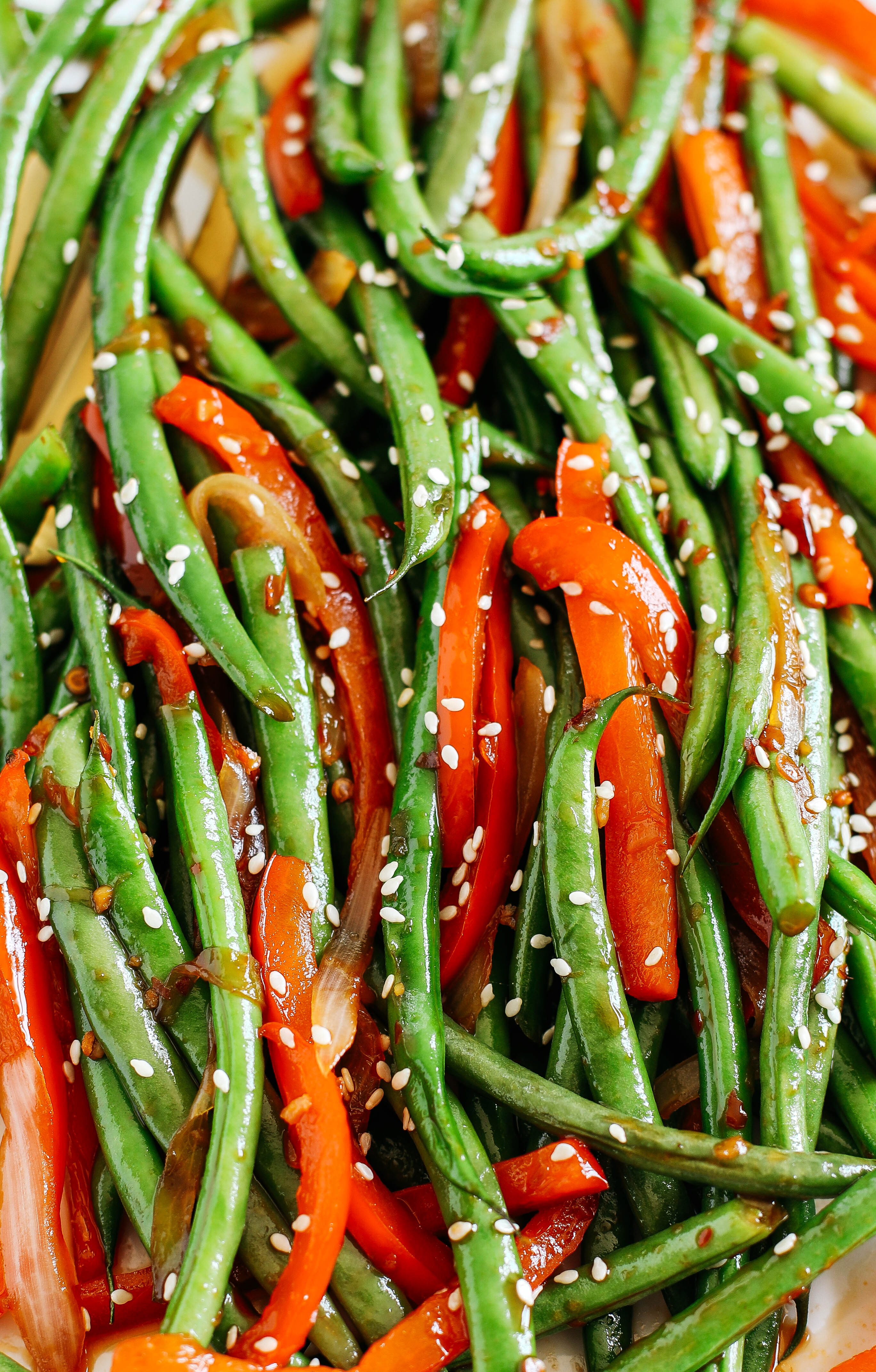 Delicious Ginger Soy Glazed Green Beans and Peppers make a quick and easy side dish that is full of flavor and tastes like you ordered them from your favorite Asian restaurant!  