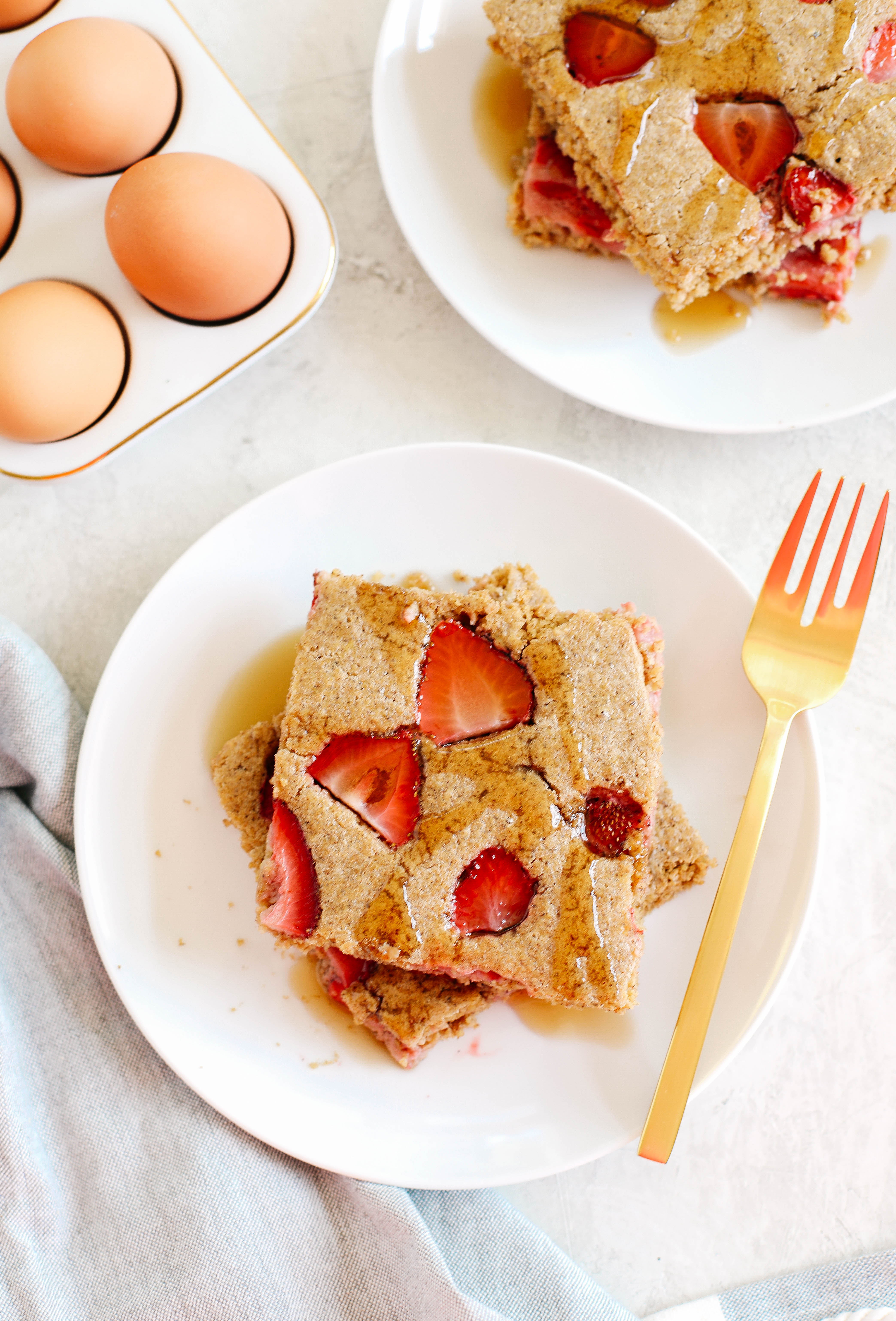 These quick and easy Sheet Pan Strawberry Pancakes are the best way to make a bunch of pancakes all at once and are ready in just 15 minutes!  Gluten free and perfect for a crowd!