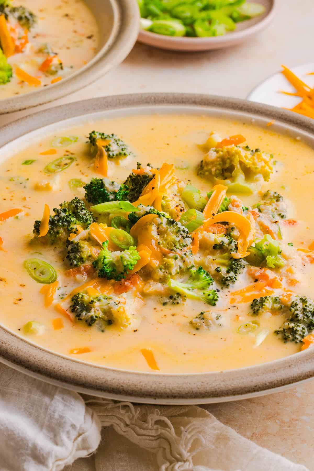 Creamy broccoli cheddar soup with broccoli, carrots and shredded cheddar cheese