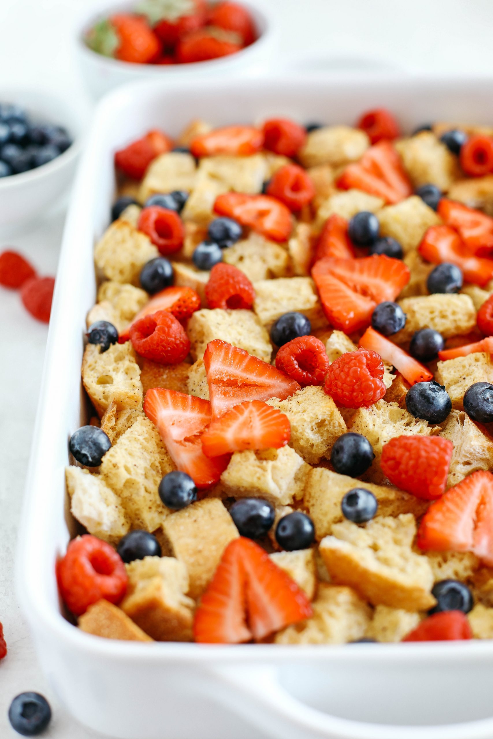Warm and flavorful Mixed Berry French Toast Casserole with a delicious cream cheese drizzle that can easily be made the night before for the perfect morning breakfast!