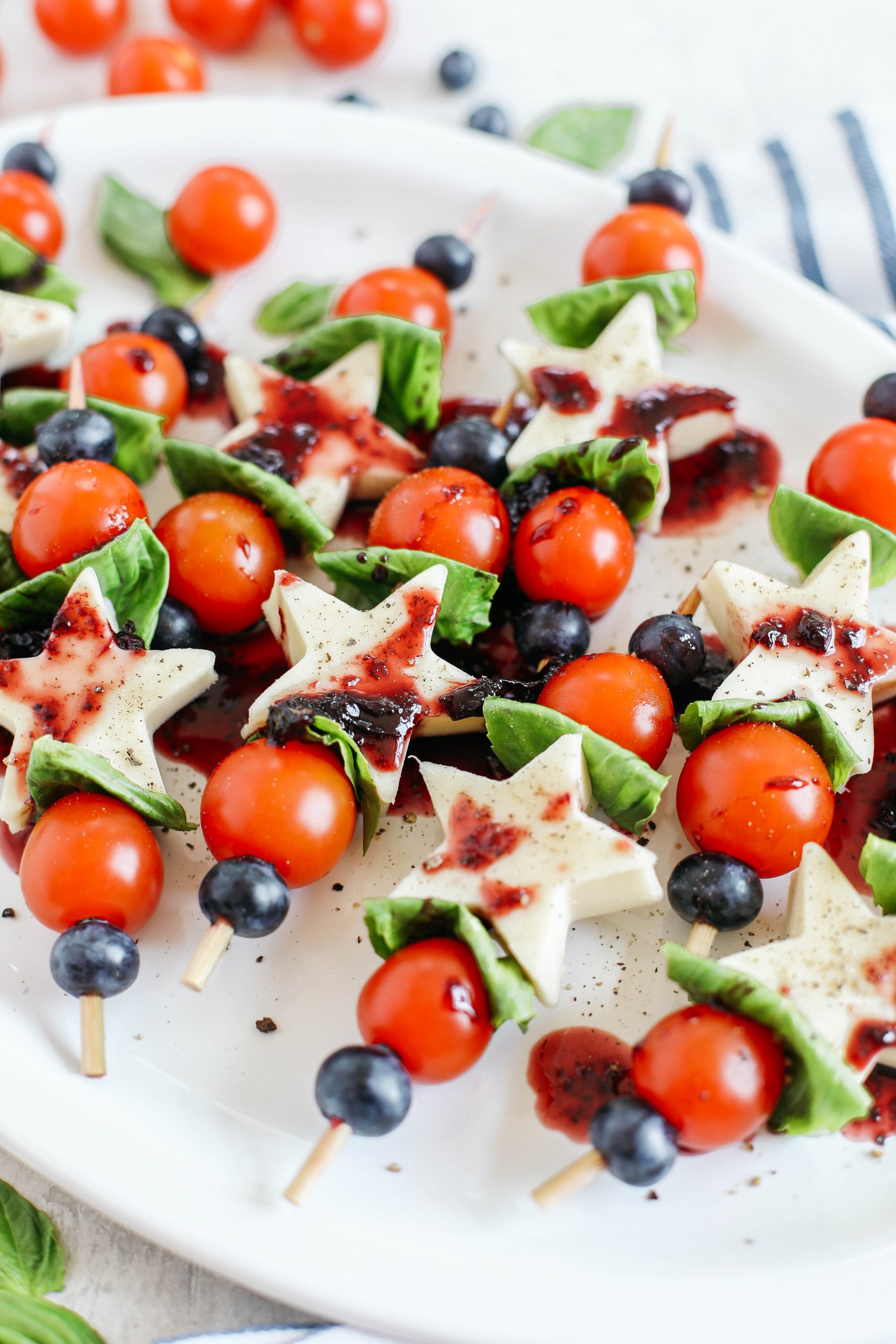 These Caprese Skewers with Blueberry Balsamic Glaze are healthy, incredibly delicious and make the perfect festive appetizer for Memorial Day, 4th of July or Labor Day weekend!