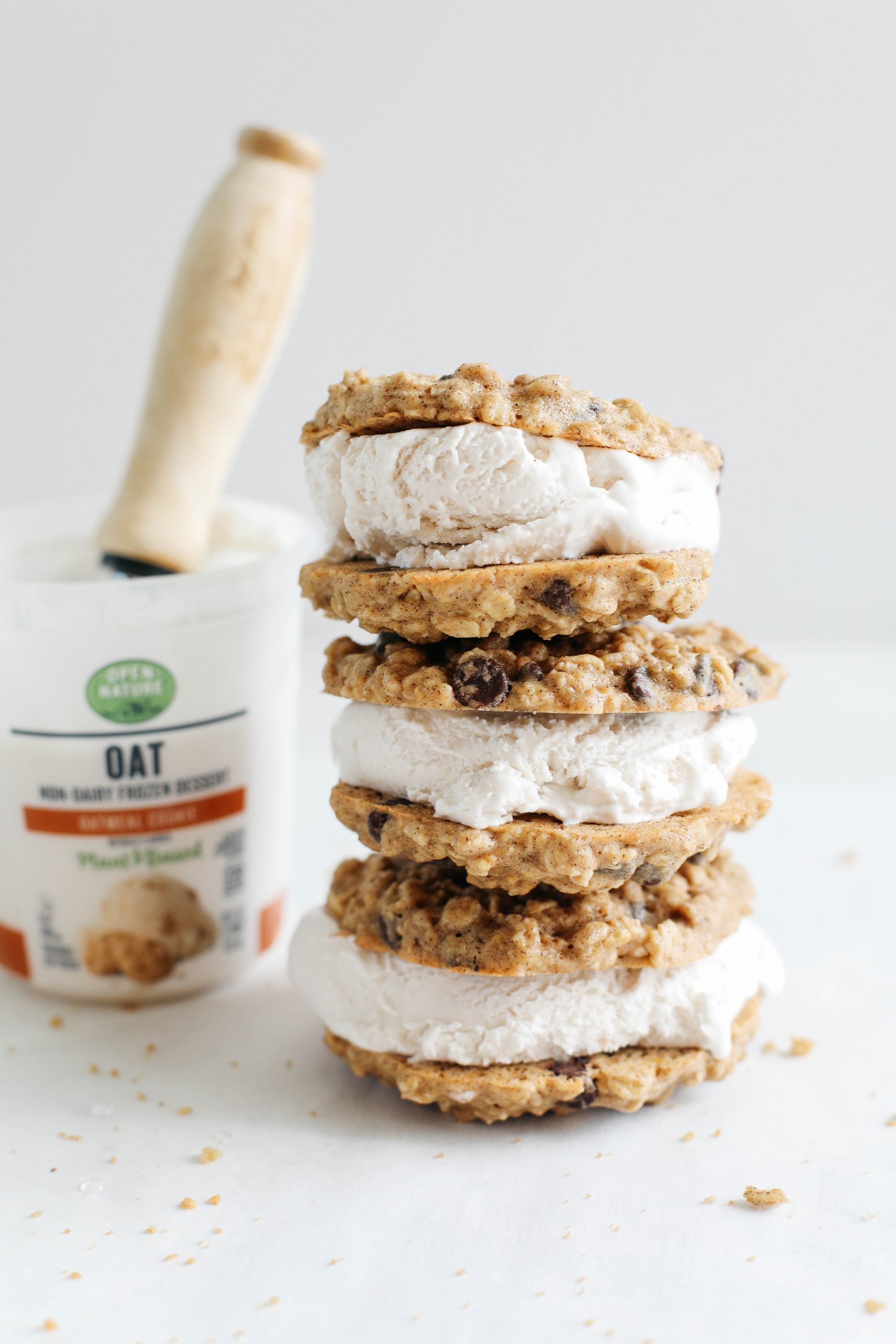 Celebrate the summer with these homemade oatmeal chocolate chip cookie ice cream sandwiches that are dairy-free, vegan and taste just like your childhood!