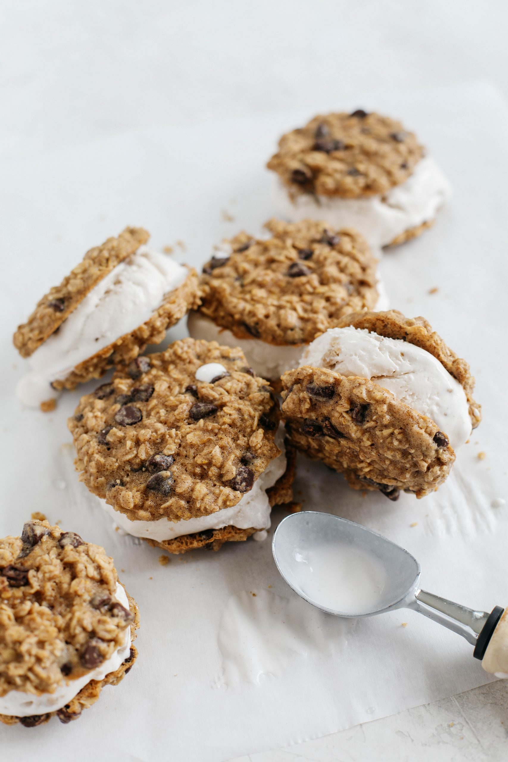 Celebrate the summer with these homemade oatmeal chocolate chip cookie ice cream sandwiches that are dairy-free, vegan and taste just like your childhood!
