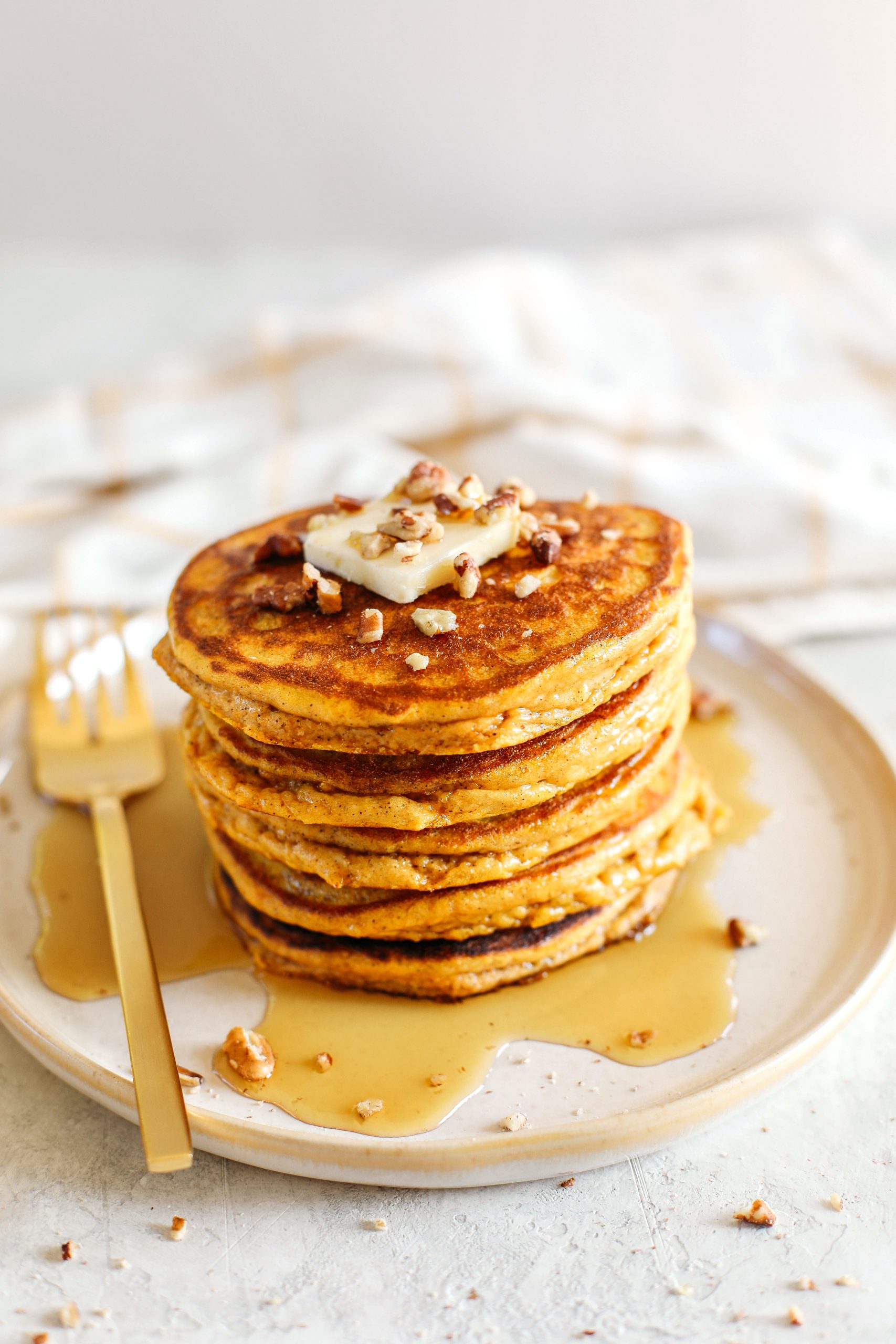 Start your morning with these fluffy pumpkin pancakes that are gluten-free, dairy-free and paleo with zero refined sugars made with almond flour for an easy delicious fall breakfast!