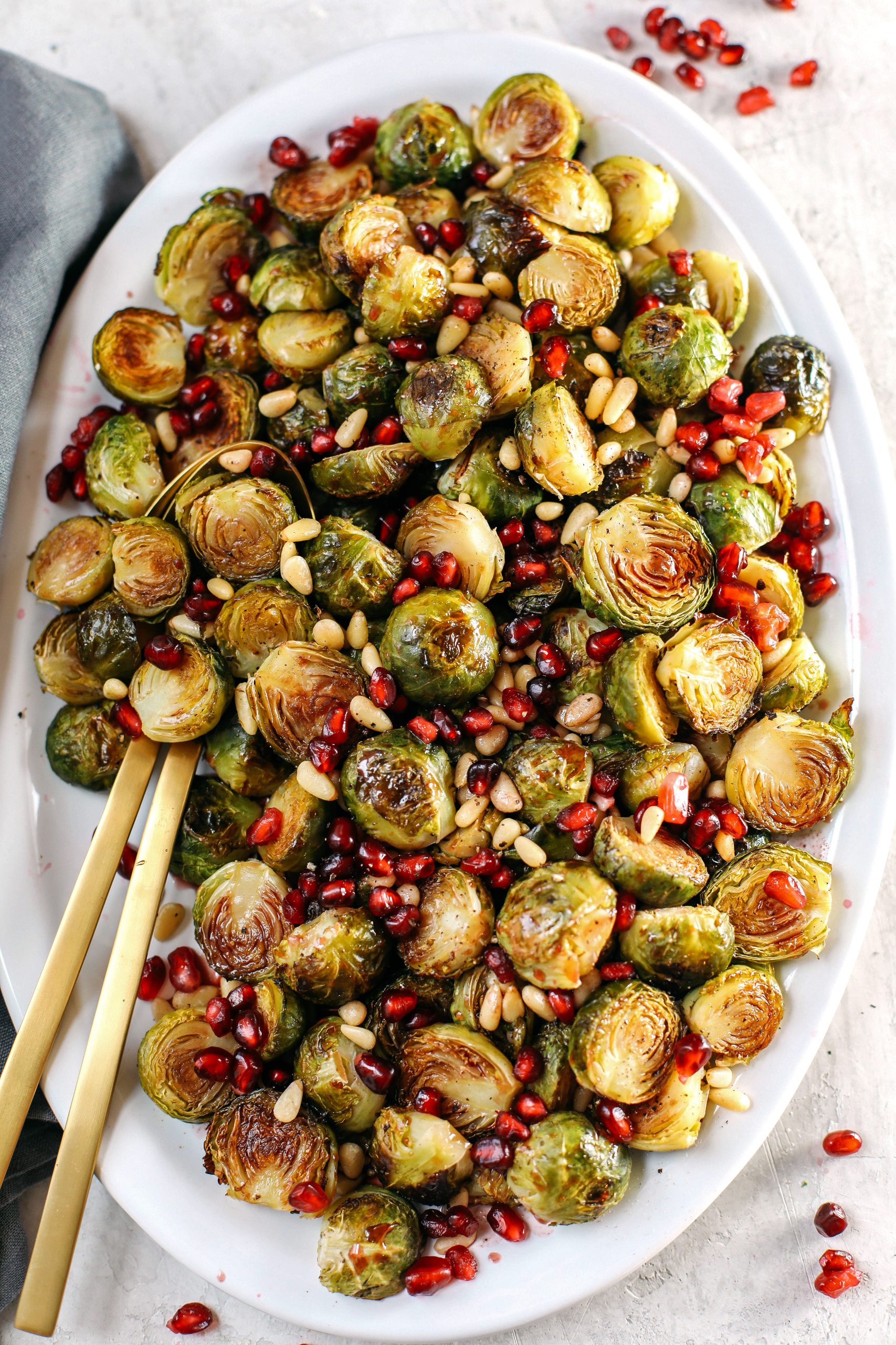 These Pomegranate Glazed Brussels Sprouts are savory, sweet and roasted to perfection making them the perfect holiday side dish for your table this season!