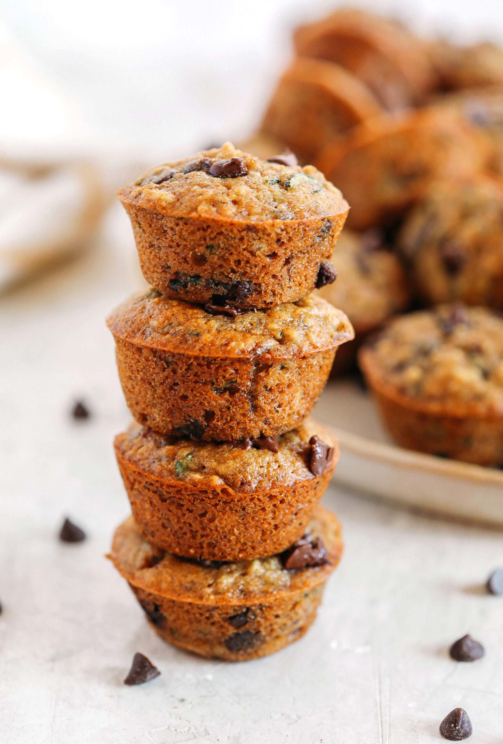 Healthy bite-sized Chocolate Chip Banana Zucchini Muffins that are moist and delicious with hidden veggies and naturally sweetened with banana and honey!