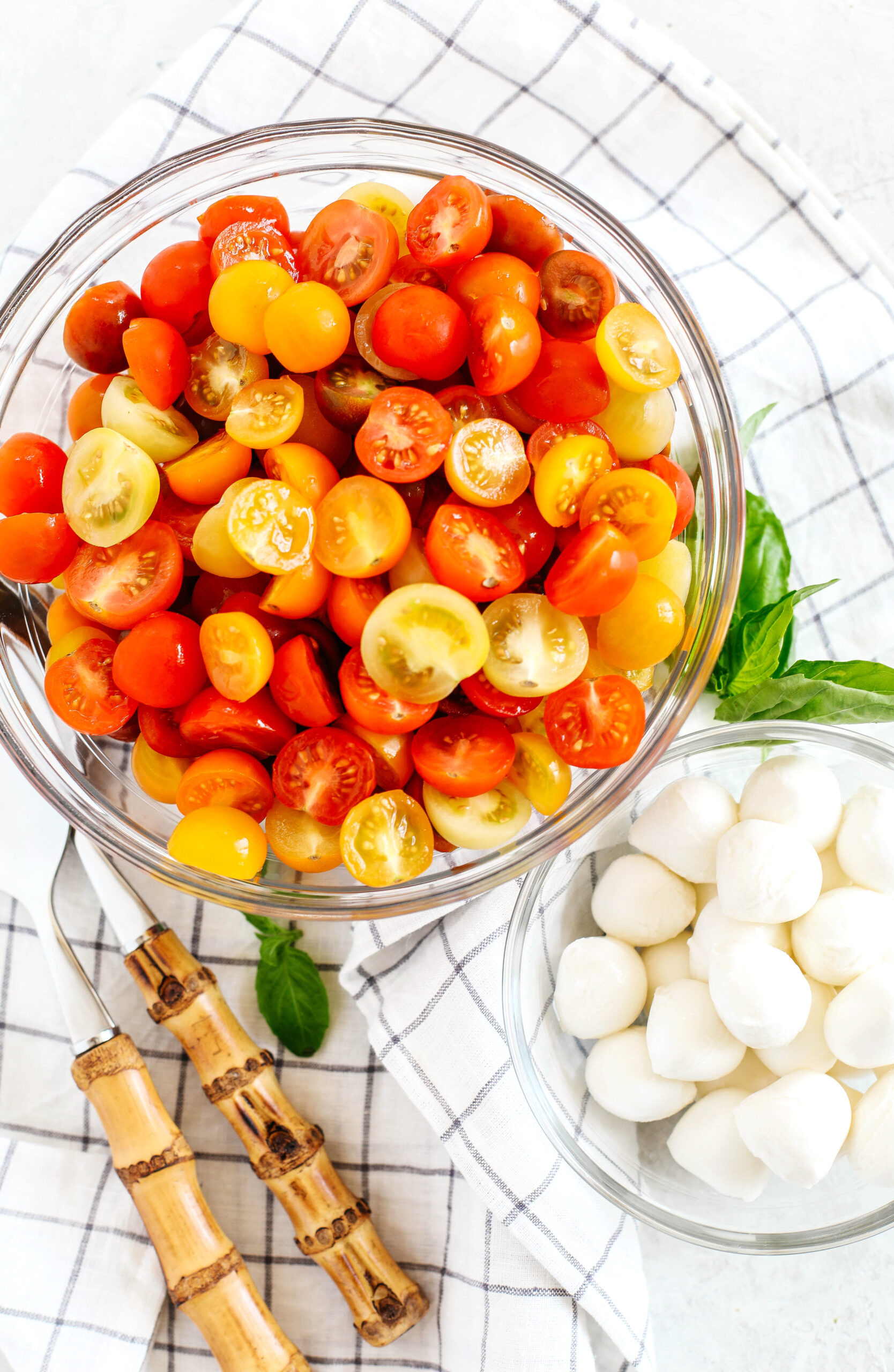 This Summer Caprese Salad is loaded with juicy tomatoes and creamy balls of mozzarella cheese all marinated in a delicious combination of olive oil, balsamic vinegar, garlic and fresh herbs!