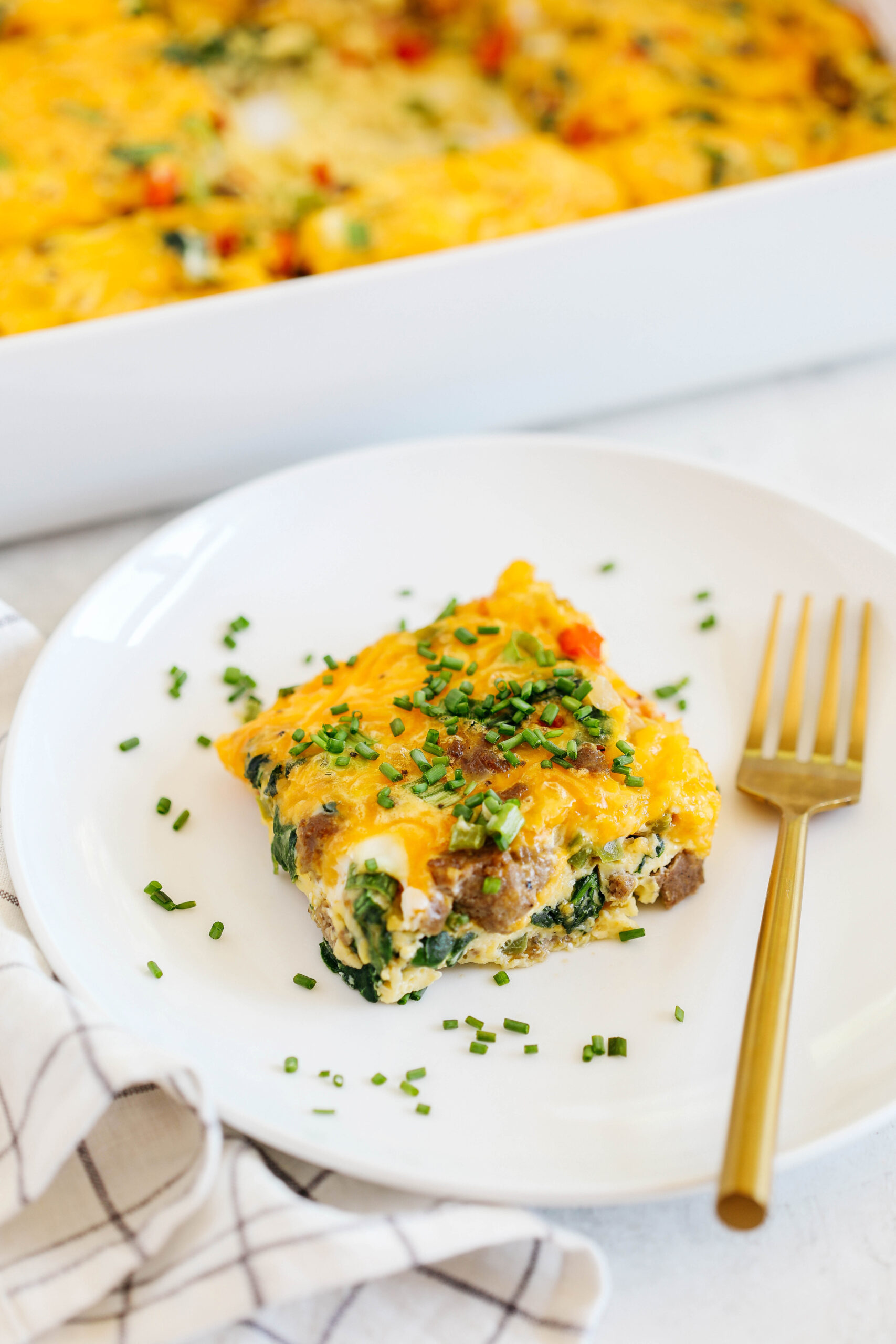 This Sausage and Veggie Egg Casserole makes the perfect low carb savory breakfast loaded with your favorite veggies, leafy greens, and delicious turkey sausage that is sure to be a crowdpleaser!