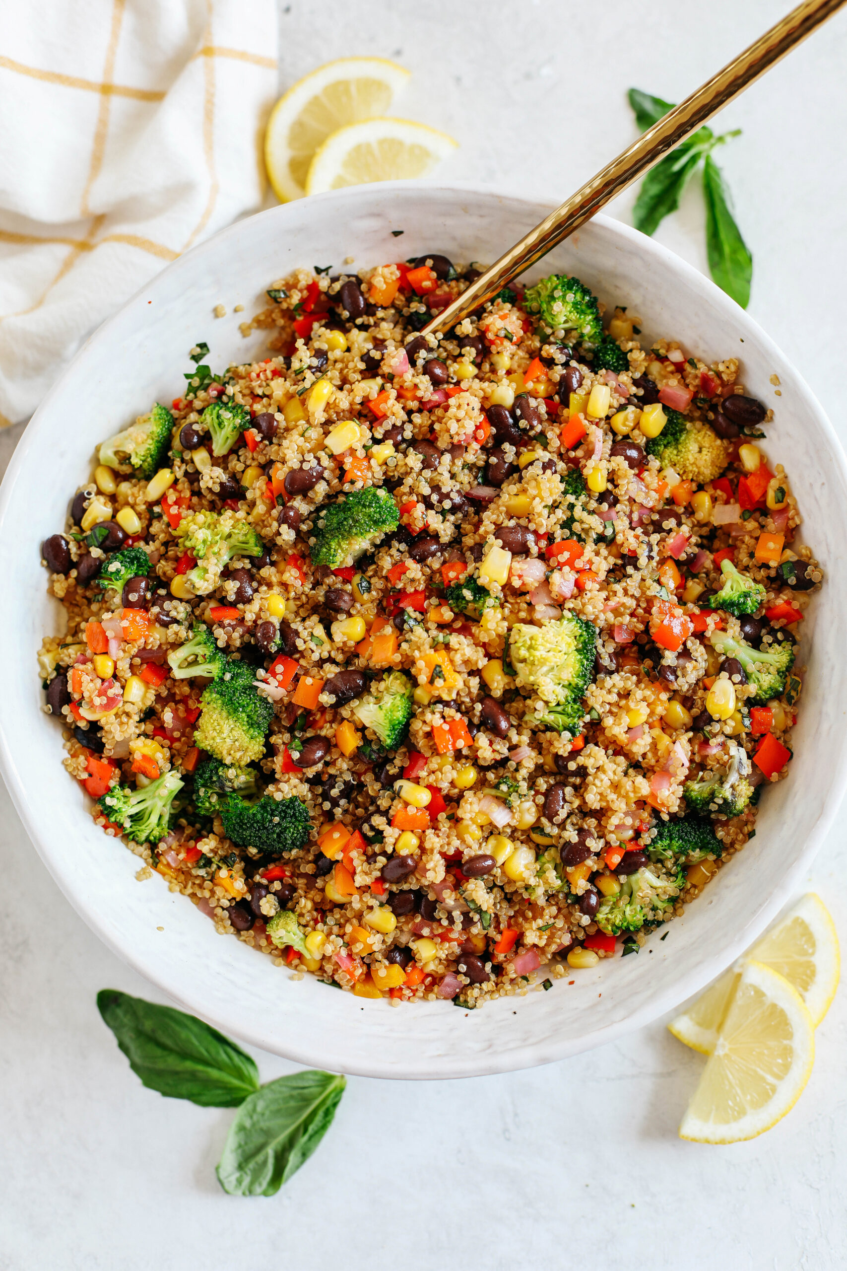 The perfect Summer Quinoa Salad made with a delicious combination of sautéed veggies, black beans, corn, and fresh basil all tossed with a lemon balsamic dressing!