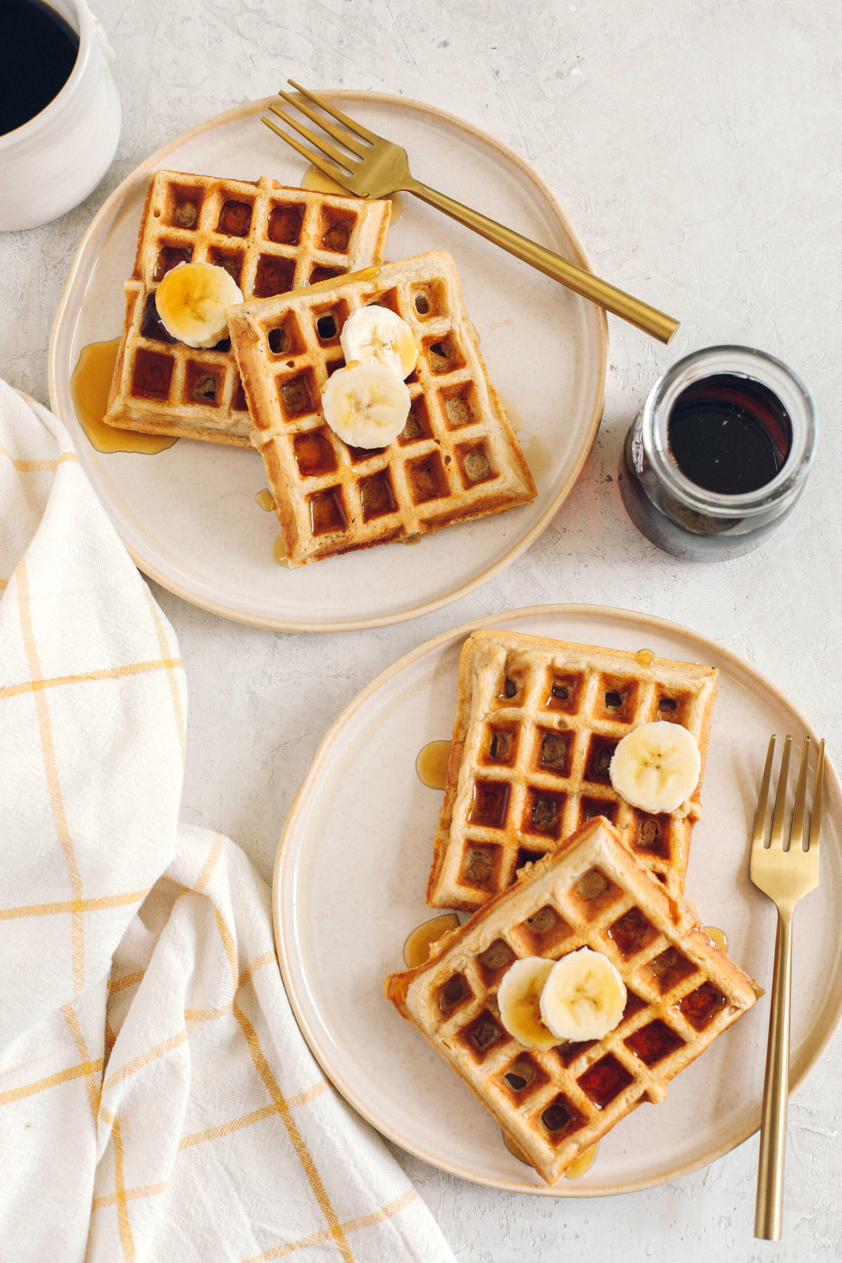 Light and fluffy Whole Wheat Banana Waffles with perfectly crisp edges, warm spices and made with zero refined sugar for the perfect healthy morning breakfast!
