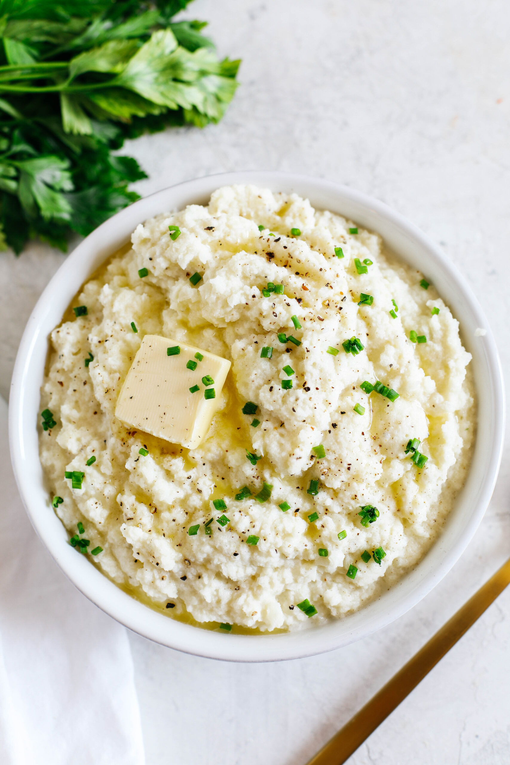 This EASY Mashed Cauliflower is creamy, delicious, and makes the perfect low carb, keto-friendly side dish easily made in under 15 minutes! #keto
